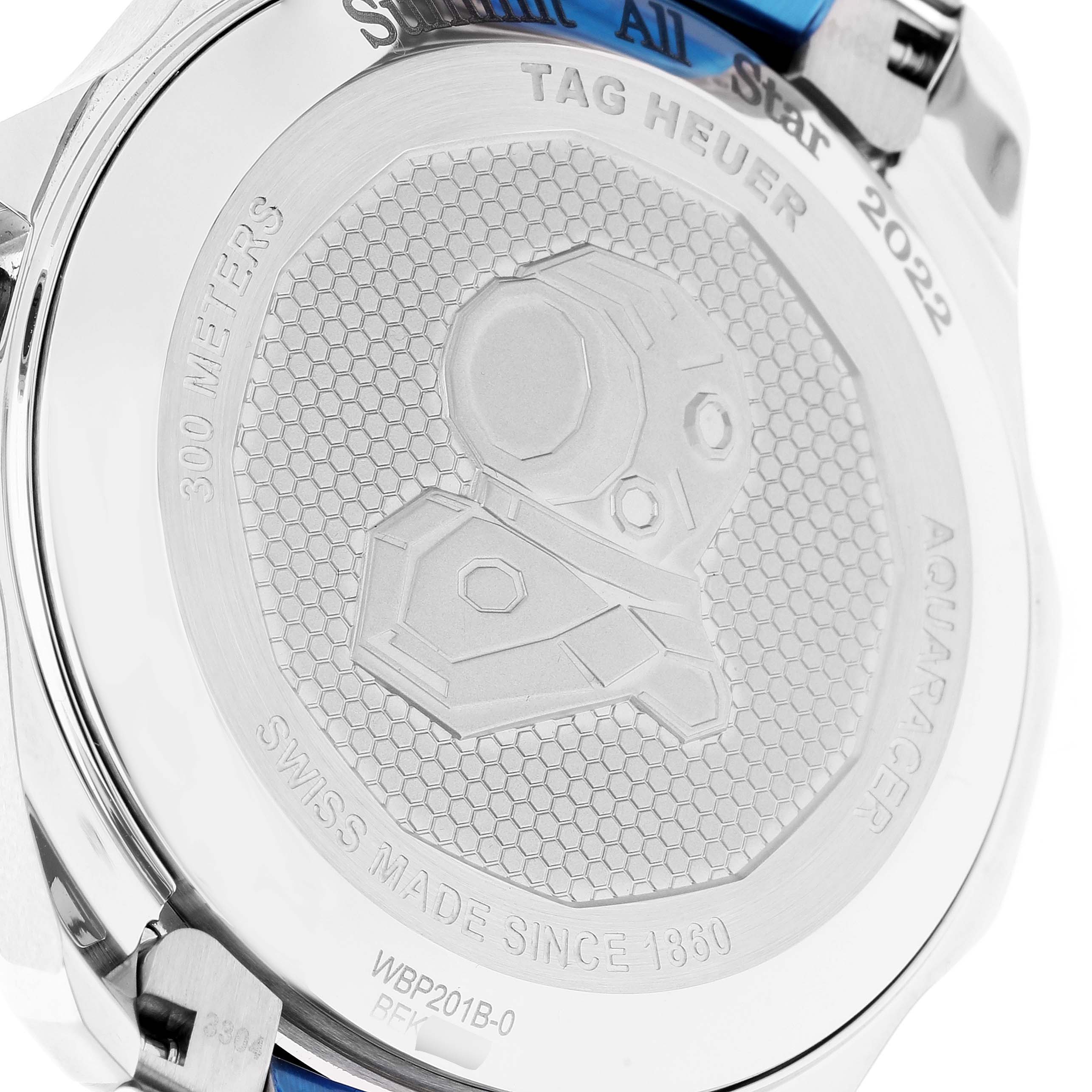 This image shows the back case of a Tag Heuer Aquaracer WBP201B.BA0632 Men's Stainless Steel Blue Dial WBP201B.BA0632 Men's Stainless Steel Blue Dial watch, highlighting its detailed engravings and brand markings.