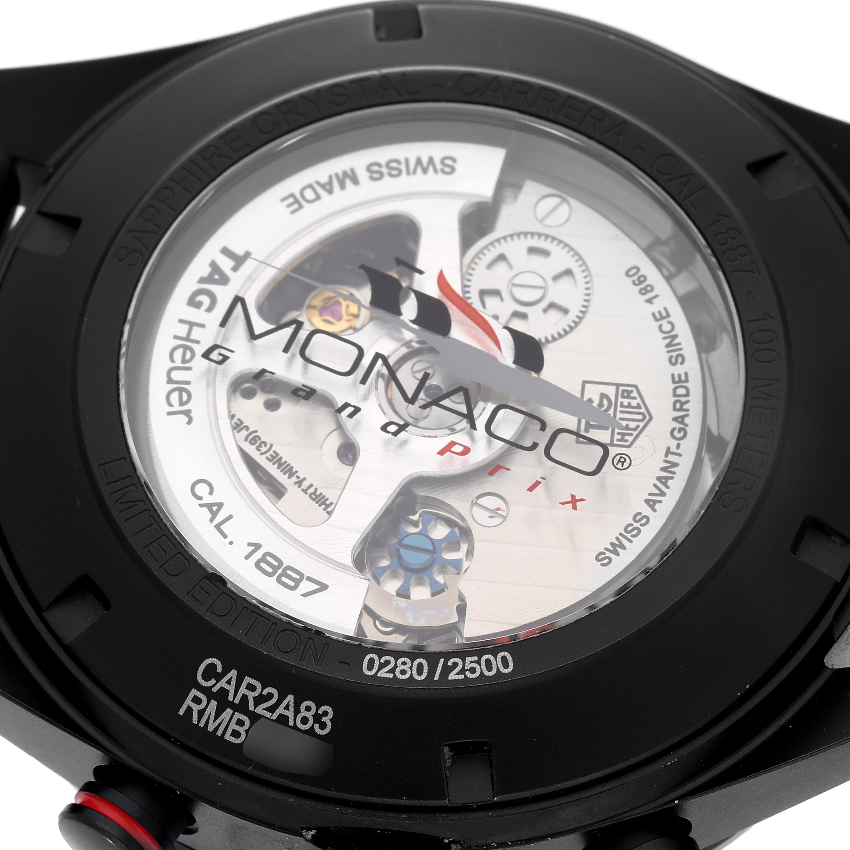 The image shows the back of a Tag Heuer Carrera CAR2A83.FT6033 Men's Titanium Black Dial CAR2A83.FT6033 Men's Titanium Black Dial watch, highlighting the transparent case back and internal mechanisms.