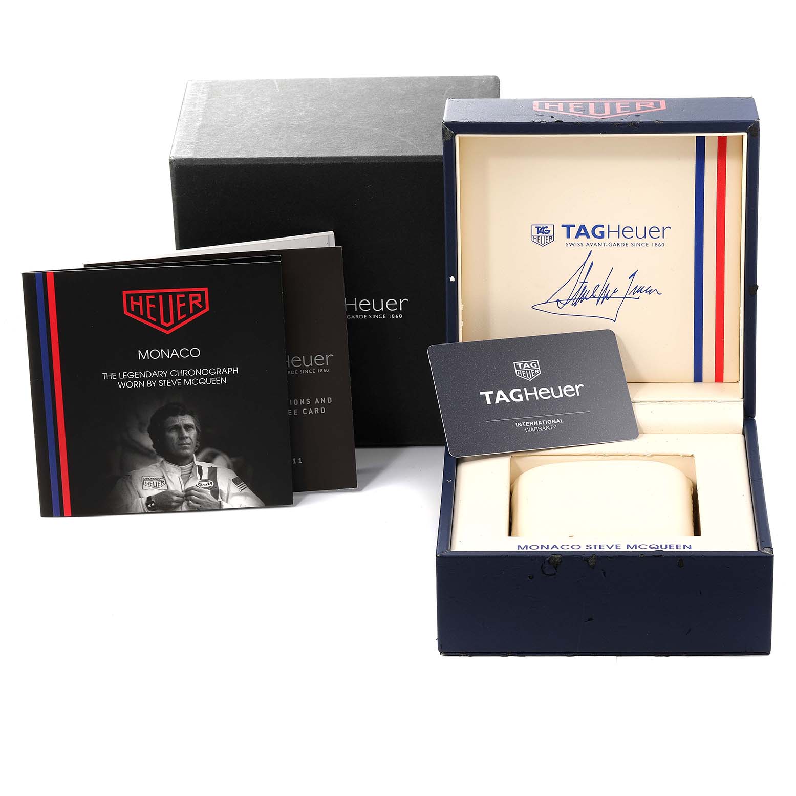 This image shows the box, warranty card, instruction manual, and booklet for the Tag Heuer Monaco CAW211P.FC6356 Men's Stainless Steel Blue Dial CAW211P.FC6356 Men's Stainless Steel Blue Dial model.