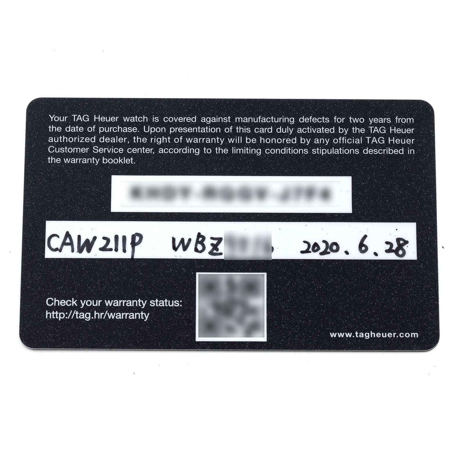This image shows the warranty card of a Tag Heuer Monaco CAW211P.FC6356 Men's Stainless Steel Blue Dial CAW211P.FC6356 Men's Stainless Steel Blue Dial model watch from a top-down angle.