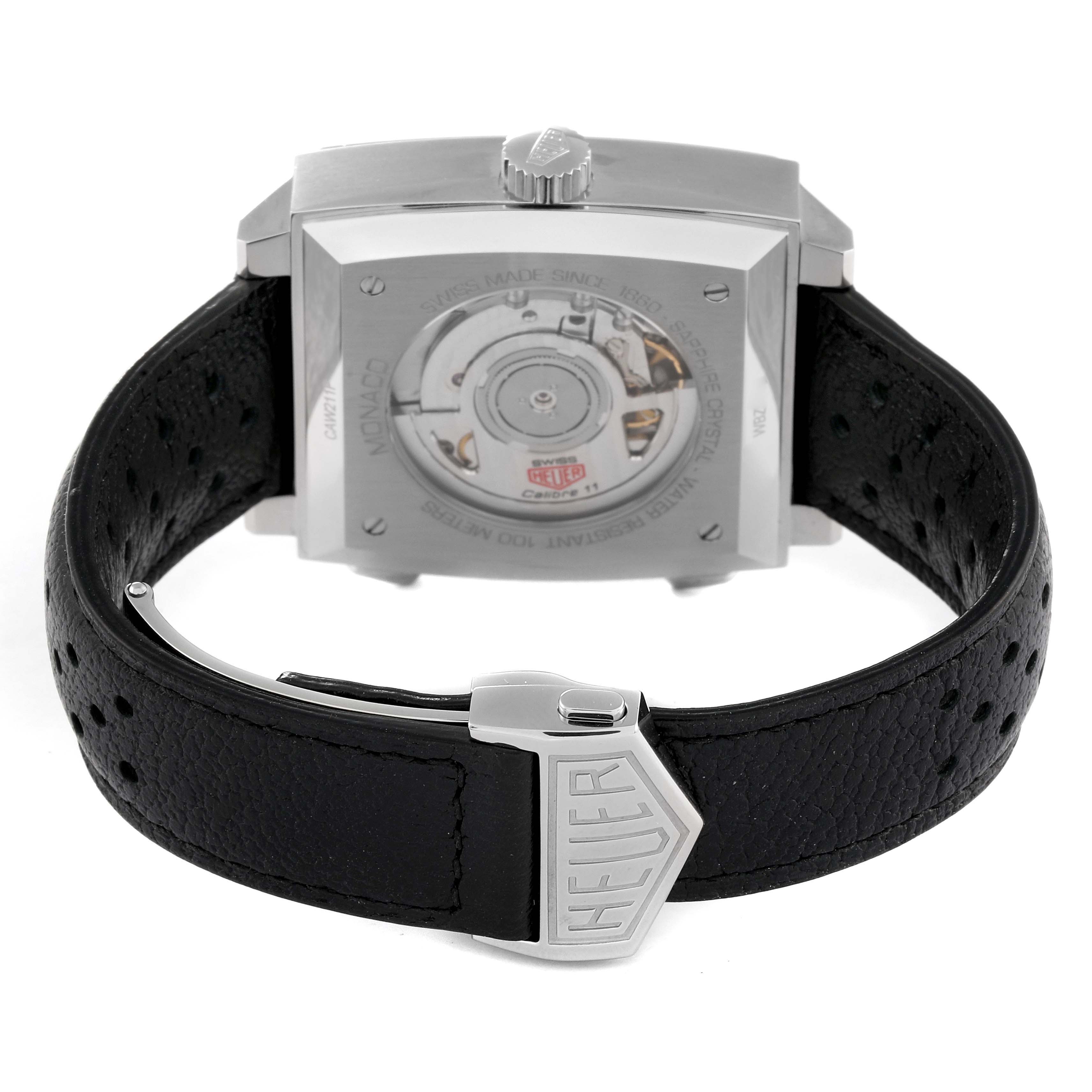 This image shows the back view of the Tag Heuer Monaco CAW211P.FC6356 Men's Stainless Steel Blue Dial CAW211P.FC6356 Men's Stainless Steel Blue Dial watch, highlighting its movement and the clasp on the leather strap.