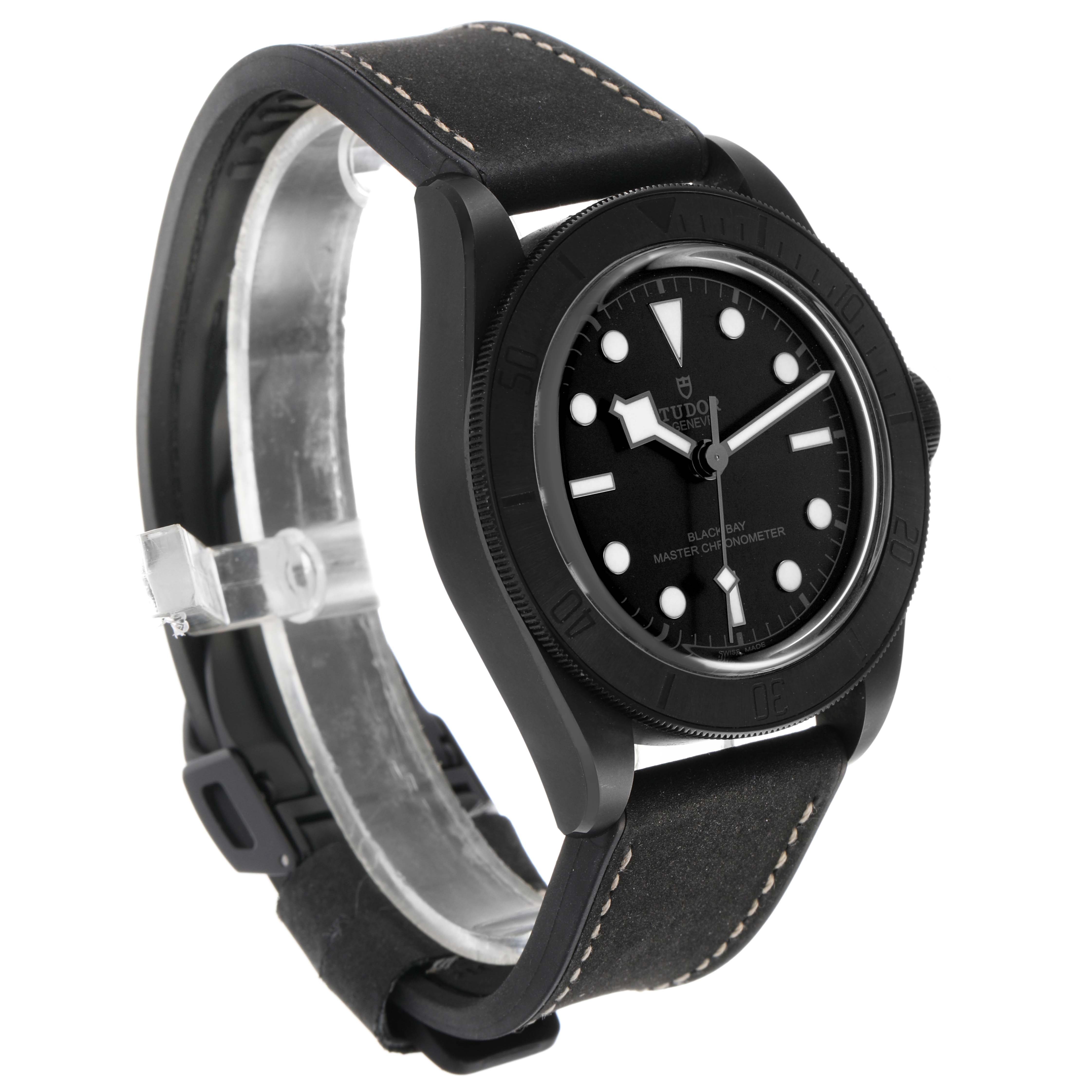The Tudor Heritage Black Bay 79210 Men's Ceramic Black Dial watch is shown at a side angle, highlighting the dial, bezel, and strap.