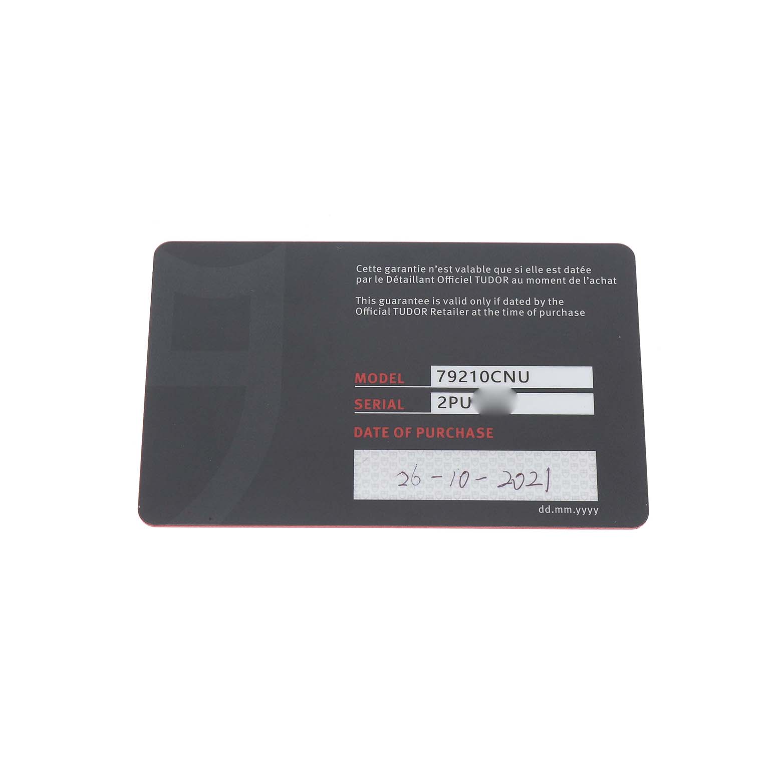 The image shows the warranty card for the Tudor Heritage Black Bay 79210 Men's Ceramic Black Dial model, displaying model, serial number, and purchase date.