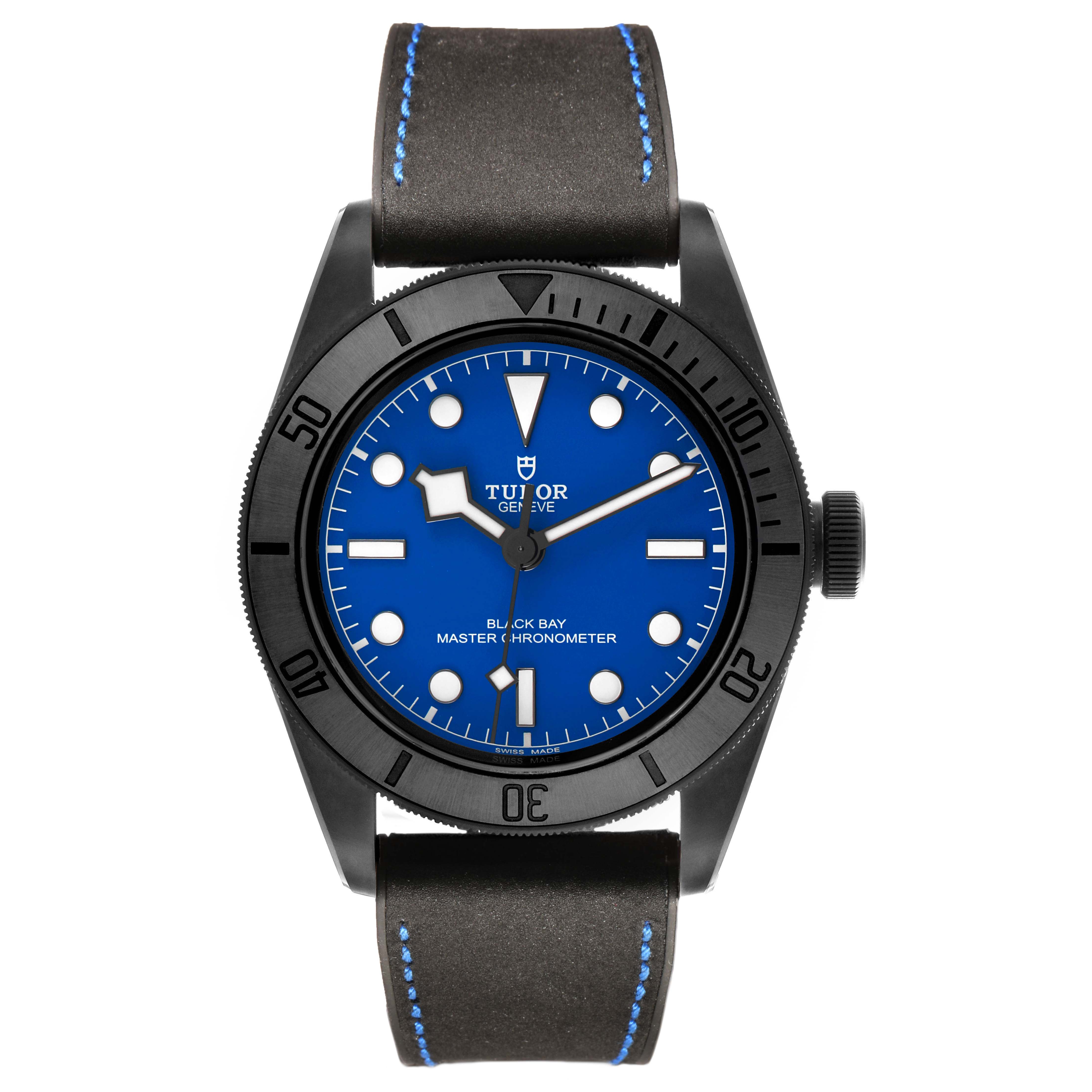 The Tudor Heritage Black Bay 79210 Men's Ceramic Blue Dial watch is shown from the front, displaying its face, bezel, and leather strap.