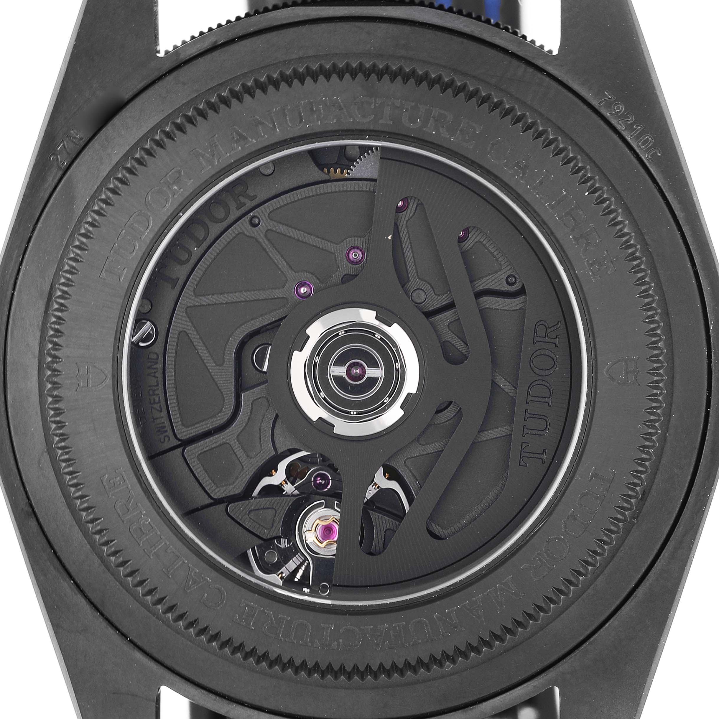 The image shows the intricate back view of the movement mechanism of the Tudor Heritage Black Bay 79210 Men's Ceramic Blue Dial watch.