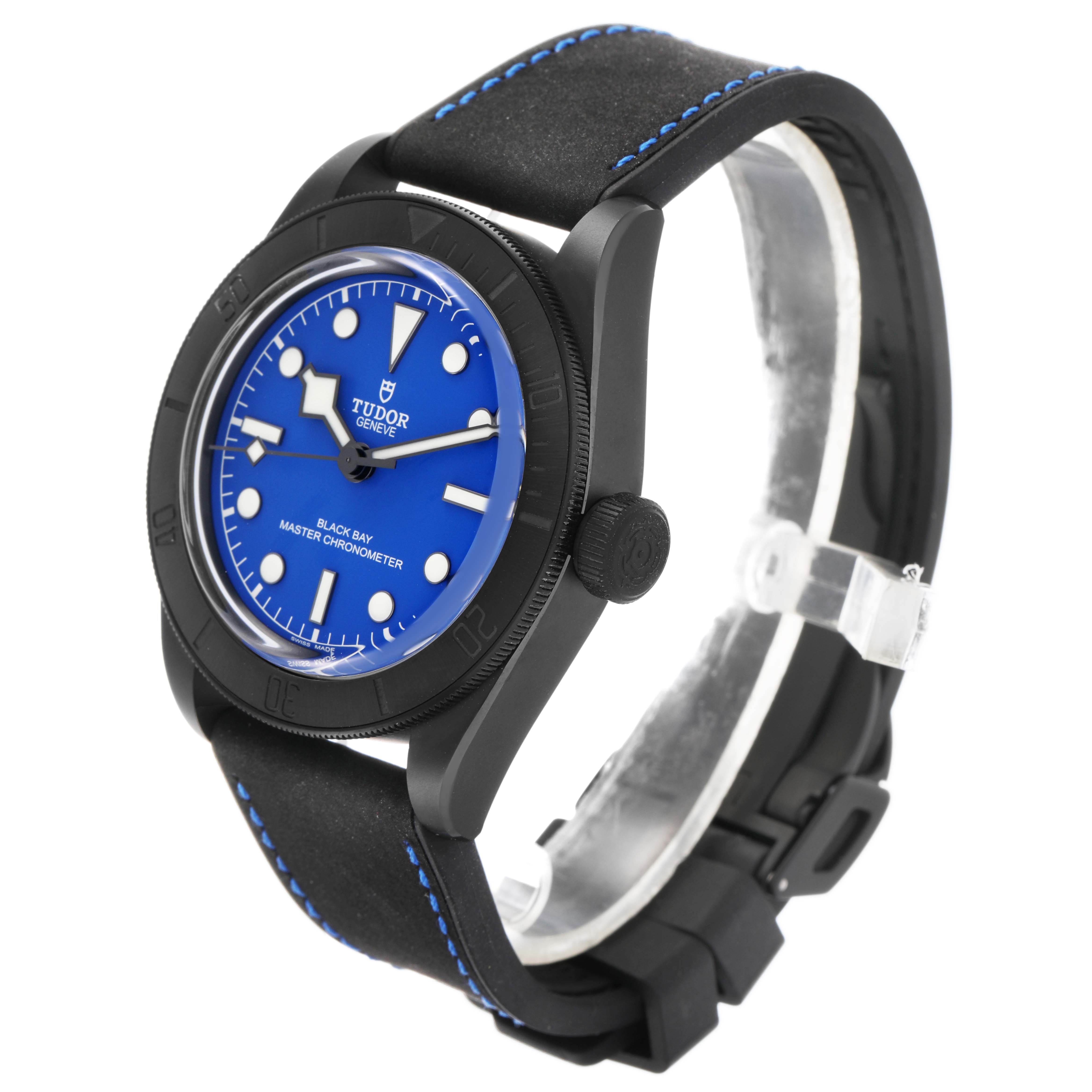The Tudor Heritage Black Bay 79210 Men's Ceramic Blue Dial watch is shown at a three-quarter angle, highlighting its blue dial, bezel, and strap.