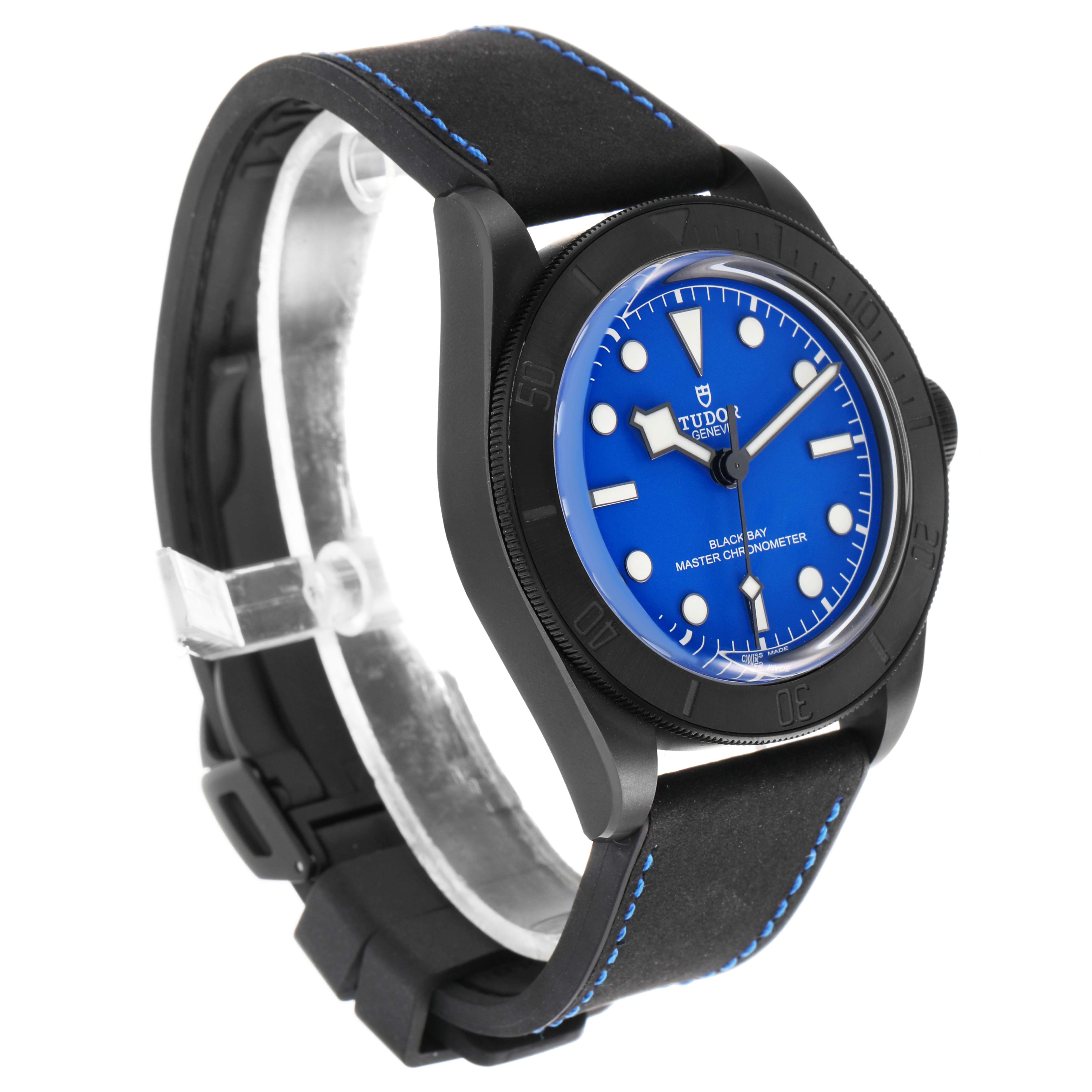 The Tudor Heritage Black Bay 79210 Men's Ceramic Blue Dial watch is shown from a three-quarter angle, displaying the face, bezel, and strap.