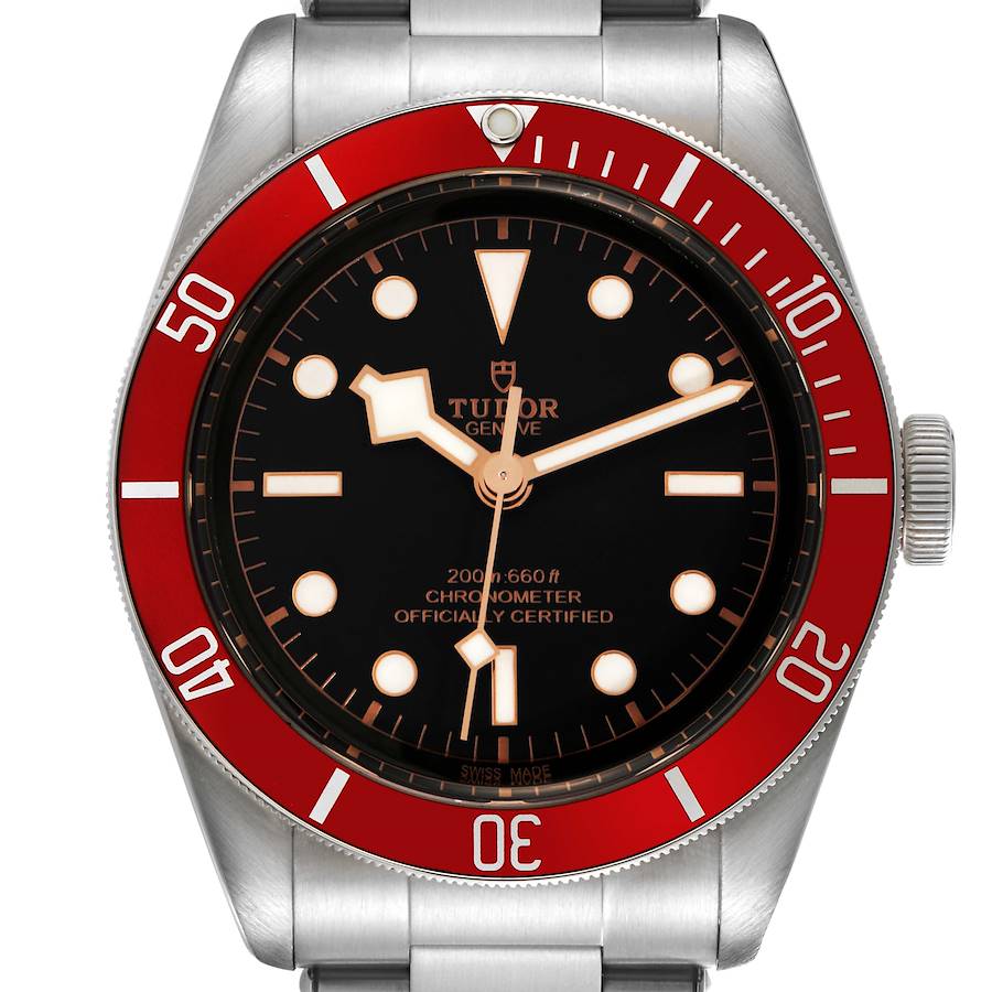 The Tudor Heritage Black Bay watch is shown from the front, highlighting the dial, bezel, and part of the bracelet.