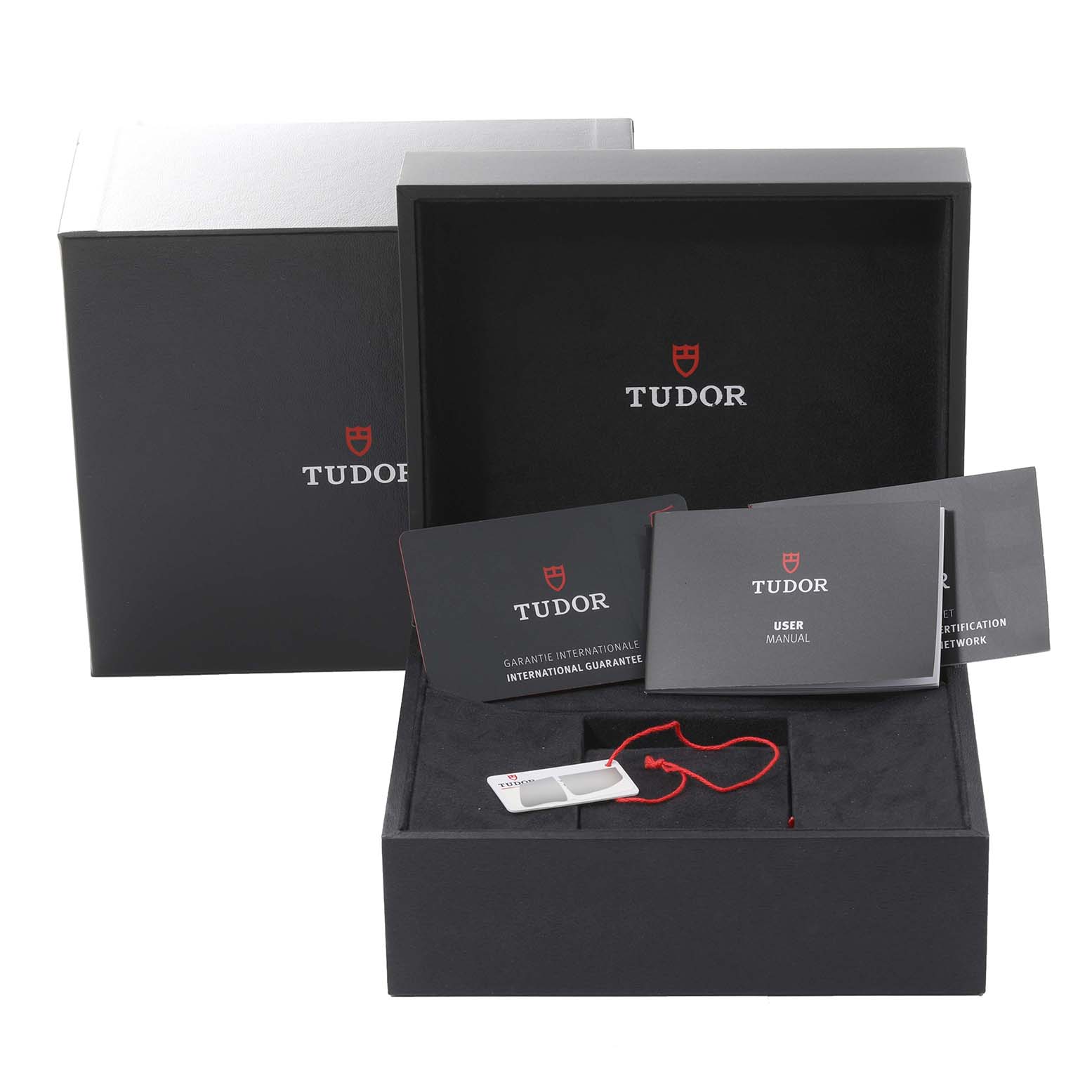 The Tudor Heritage Black Bay 79833MN Men's Steel and Gold (two tone) Black Dial 79833MN Men's Steel and Gold (two tone) Black Dial packaging includes the outer box, inner box, user manual, warranty card, and hang tag.