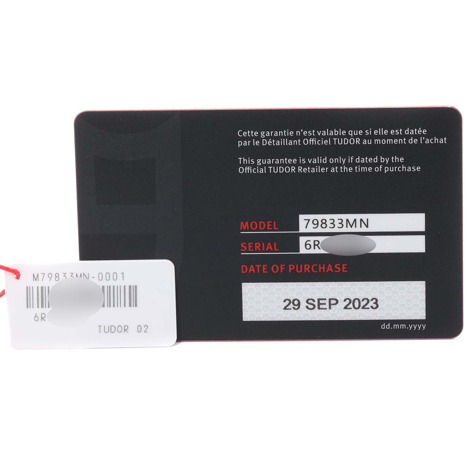 This image shows the warranty card with model and serial number, and date of purchase for the Tudor Heritage Black Bay 79833MN Men's Steel and Gold (two tone) Black Dial 79833MN Men's Steel and Gold (two tone) Black Dial watch.