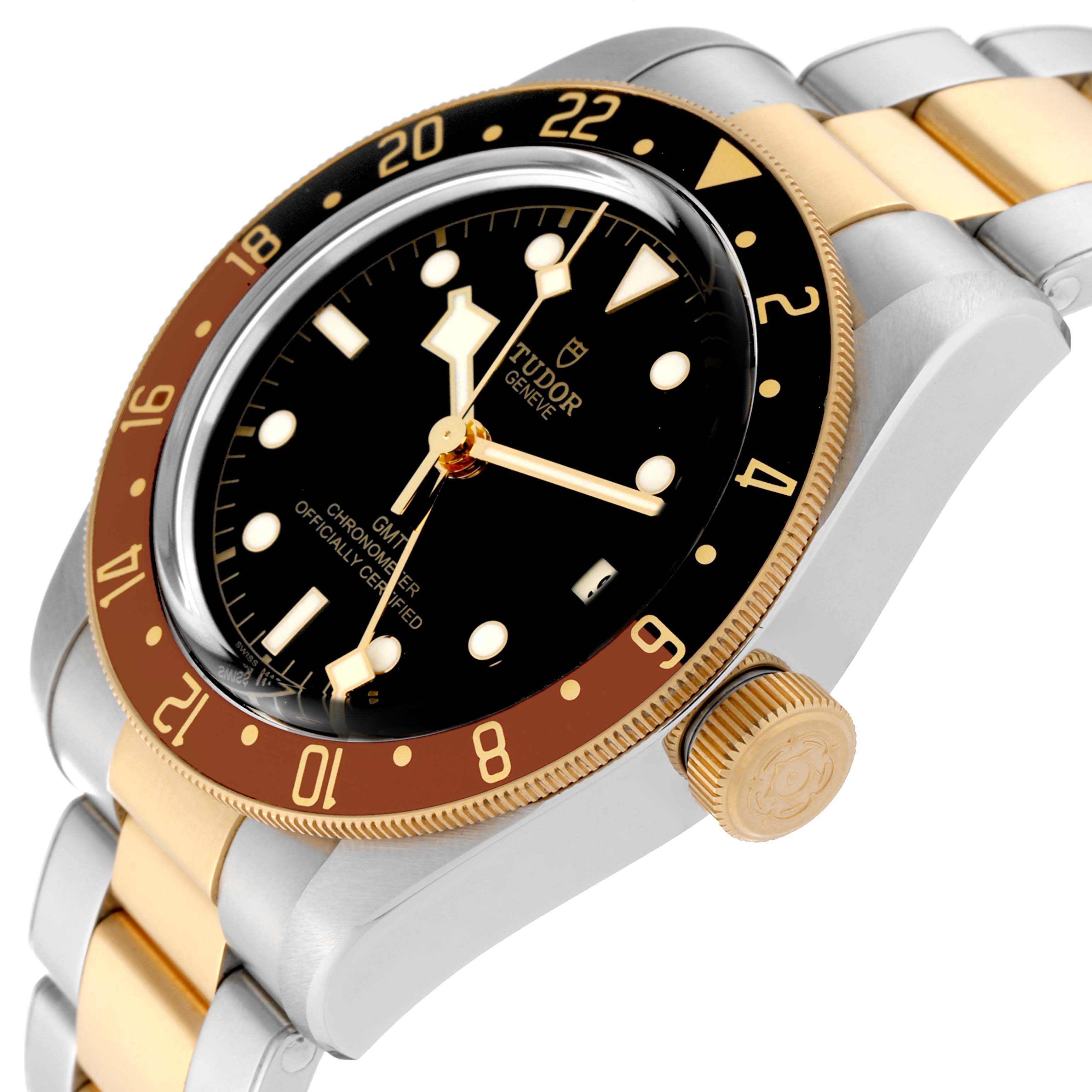 The image shows a Tudor Heritage Black Bay 79833MN Men's Steel and Gold (two tone) Black Dial 79833MN Men's Steel and Gold (two tone) Black Dial watch at a tilted angle, highlighting its bezel, crown, and part of the bracelet.