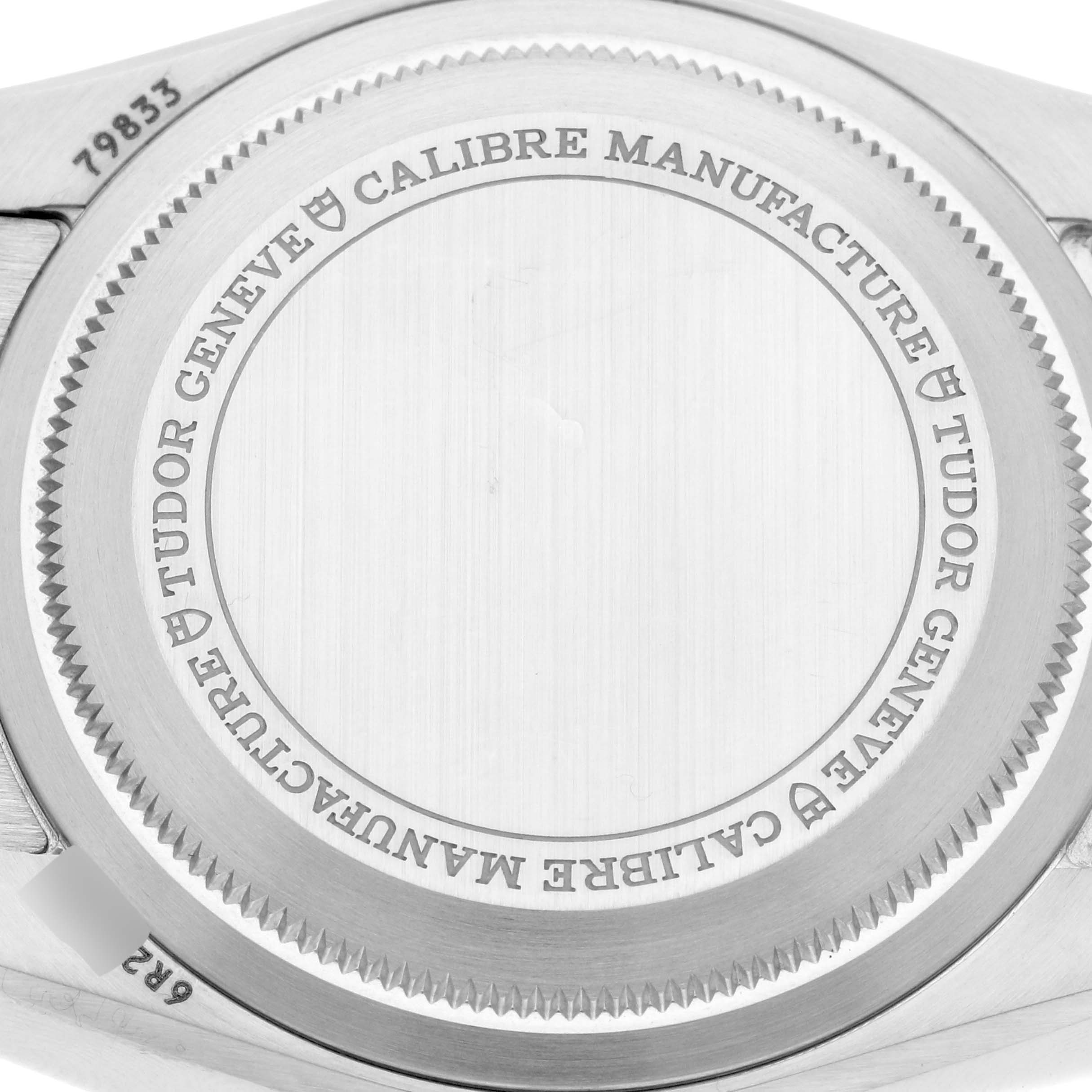 This is the case back of the Tudor Heritage Black Bay 79833MN Men's Steel and Gold (two tone) Black Dial 79833MN Men's Steel and Gold (two tone) Black Dial watch, showing engraved details and the model number.