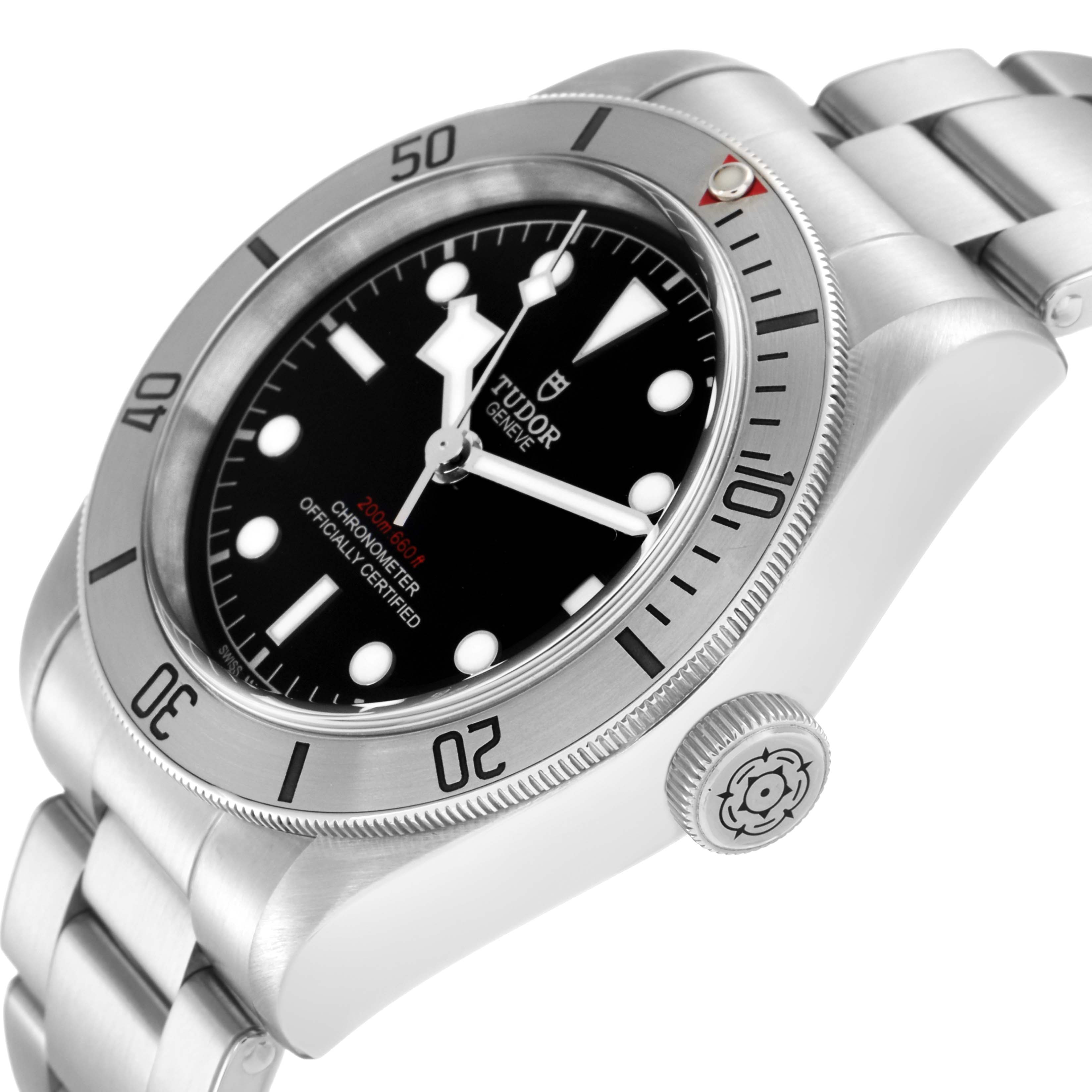 The image shows a Tudor Heritage Black Bay 79730 Men's Stainless Steel Black Dial 79730 Men's Stainless Steel Black Dial watch at an angle highlighting the bezel, crown, and bracelet.