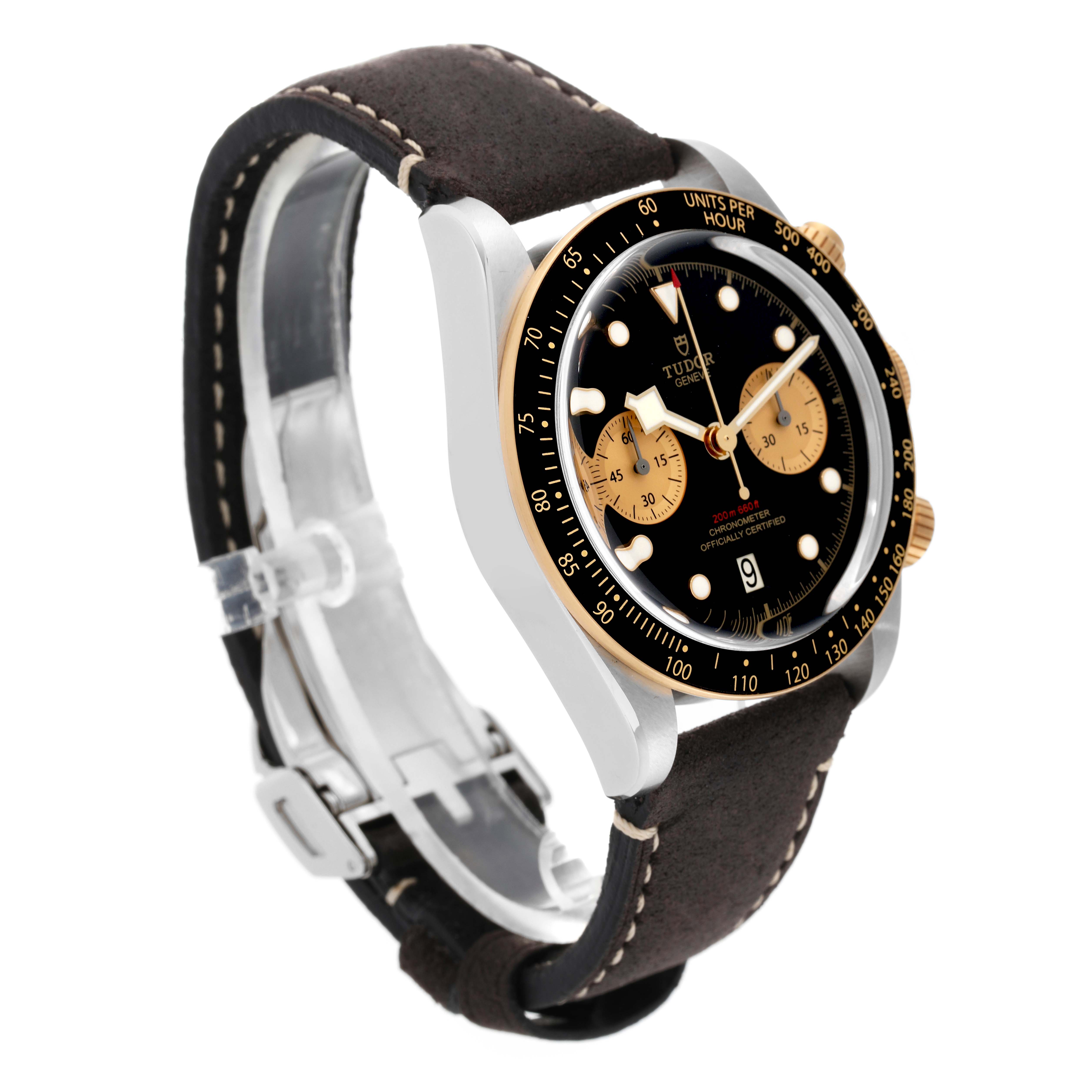 The image shows a Tudor Heritage Chrono 79363N Men's Steel and Gold (two tone) Black Dial 79363N Men's Steel and Gold (two tone) Black Dial watch at a slight angle, highlighting the dial, bezel, pushers, and leather strap.
