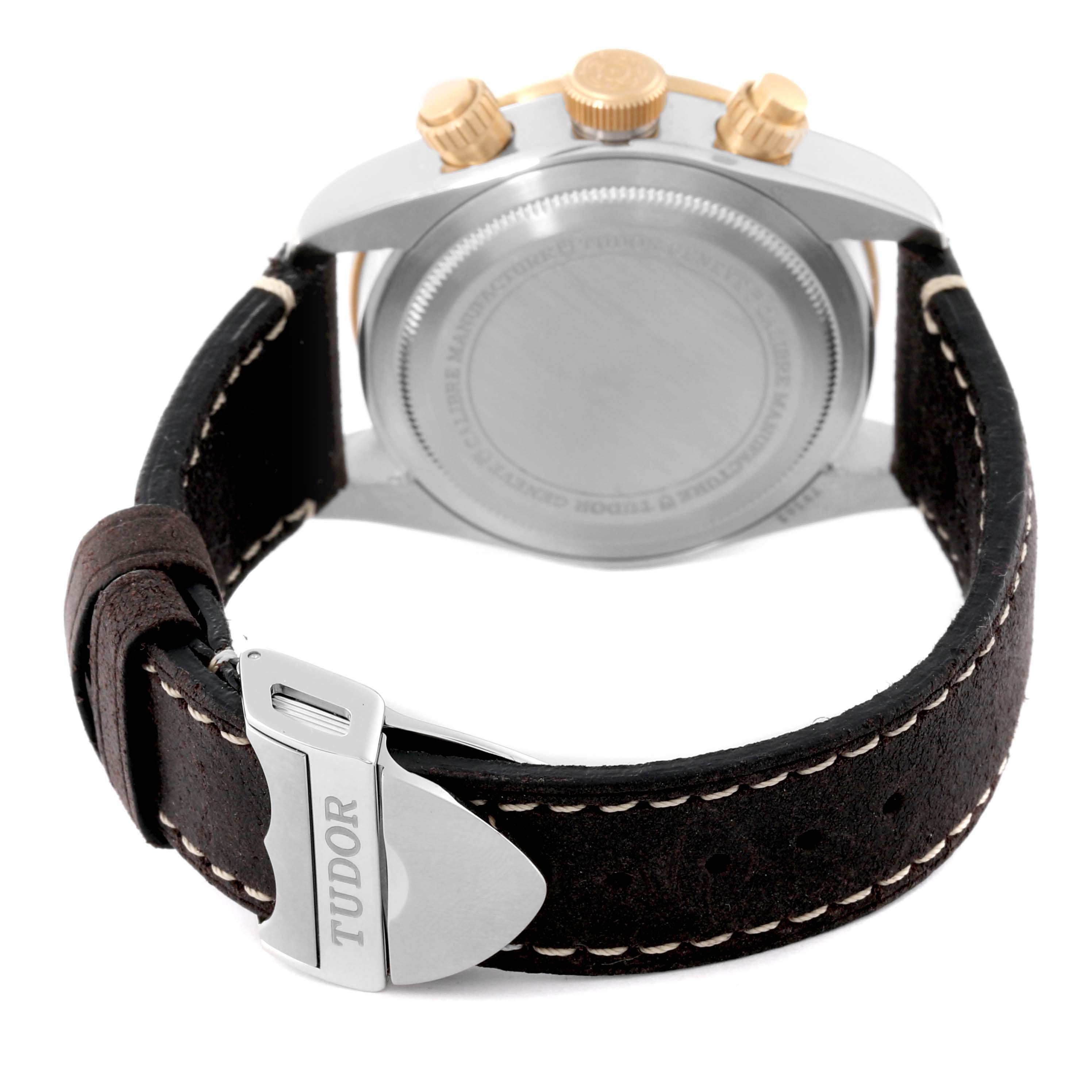 The image shows the back of the Tudor Heritage Chrono 79363N Men's Steel and Gold (two tone) Black Dial 79363N Men's Steel and Gold (two tone) Black Dial watch, featuring the case back, crown, pushers, and a leather strap with a signed buckle.
