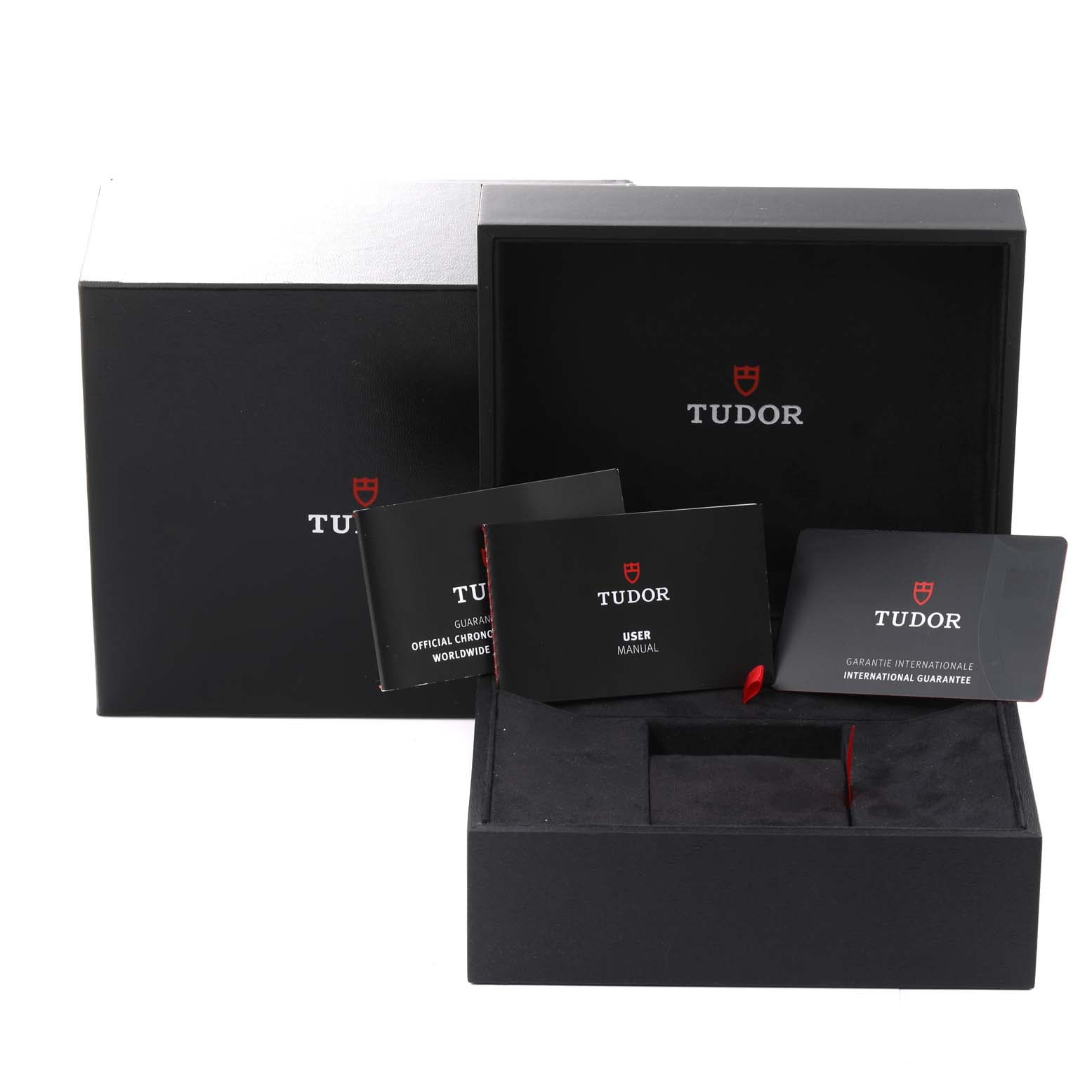 The image shows the packaging, user manual, warranty card, and paperwork for the Tudor Heritage Chrono 79363N Men's Steel and Gold (two tone) Black Dial 79363N Men's Steel and Gold (two tone) Black Dial watch.