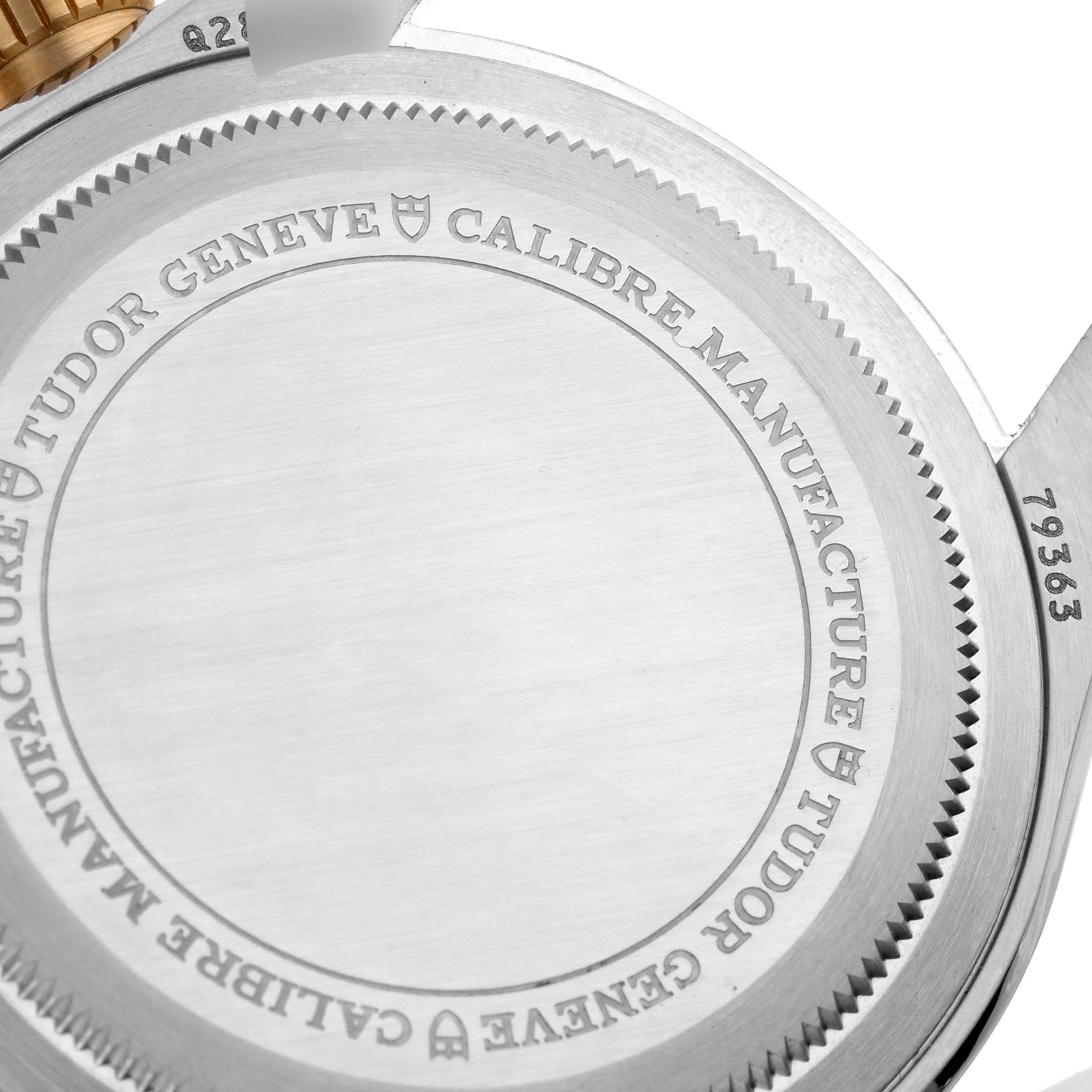 The image shows a close-up of the back case of a Tudor Heritage Chrono 79363N Men's Steel and Gold (two tone) Black Dial 79363N Men's Steel and Gold (two tone) Black Dial watch, highlighting its engravings and model number.