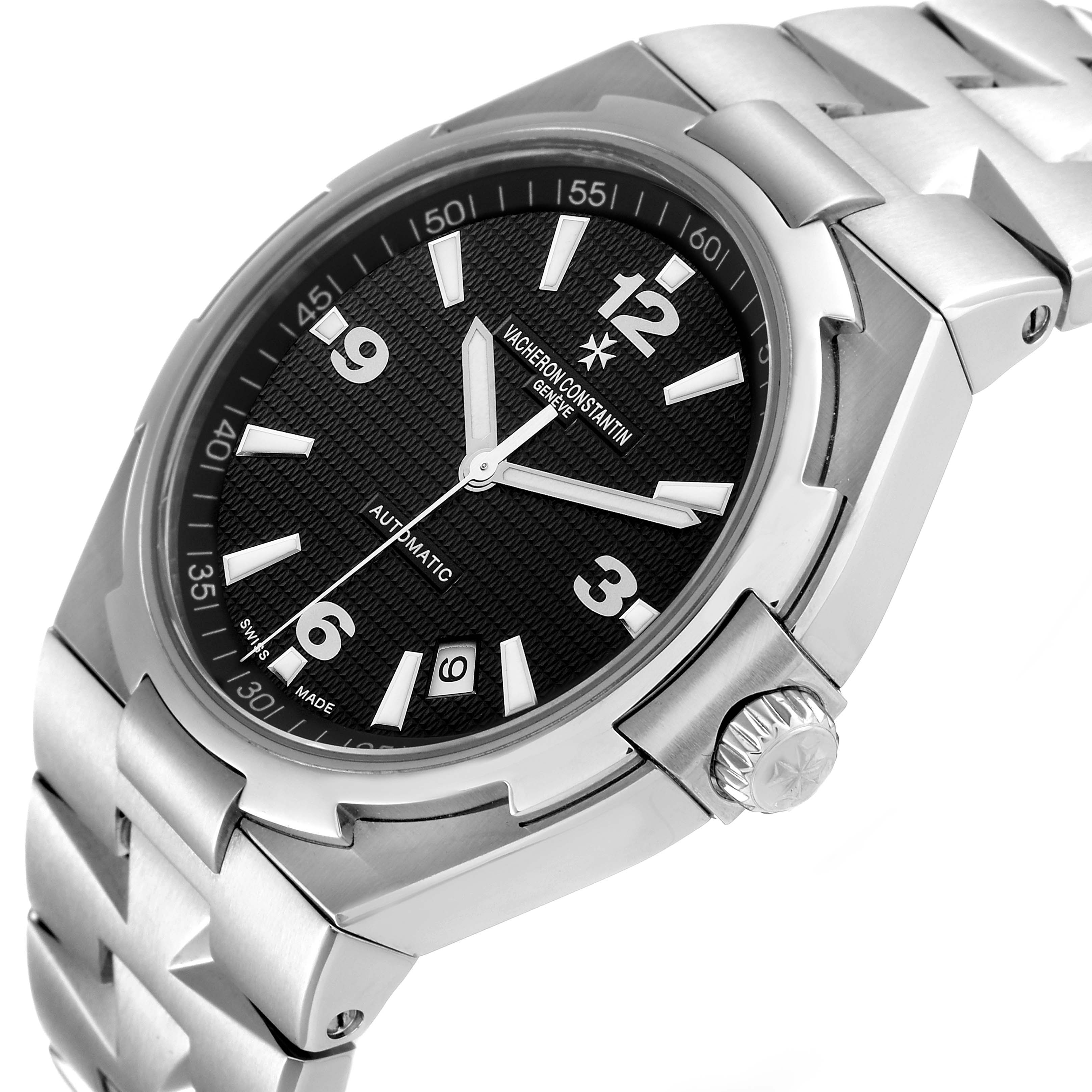 The image shows a Vacheron Constantin Overseas 47040/B01A-9094 Men's Stainless Steel Black Dial 47040/B01A-9094 Men's Stainless Steel Black Dial watch at an angled view, highlighting the dial, crown, and part of the bracelet.