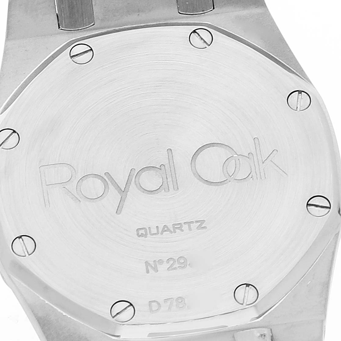 This image shows the back case of an Audemars Piguet Royal Oak 56303ST.OO.0789ST Men's Stainless Steel Black Dial 56303ST.OO.0789ST Men's Stainless Steel Black Dial Quartz watch, including visible screws and engravings.