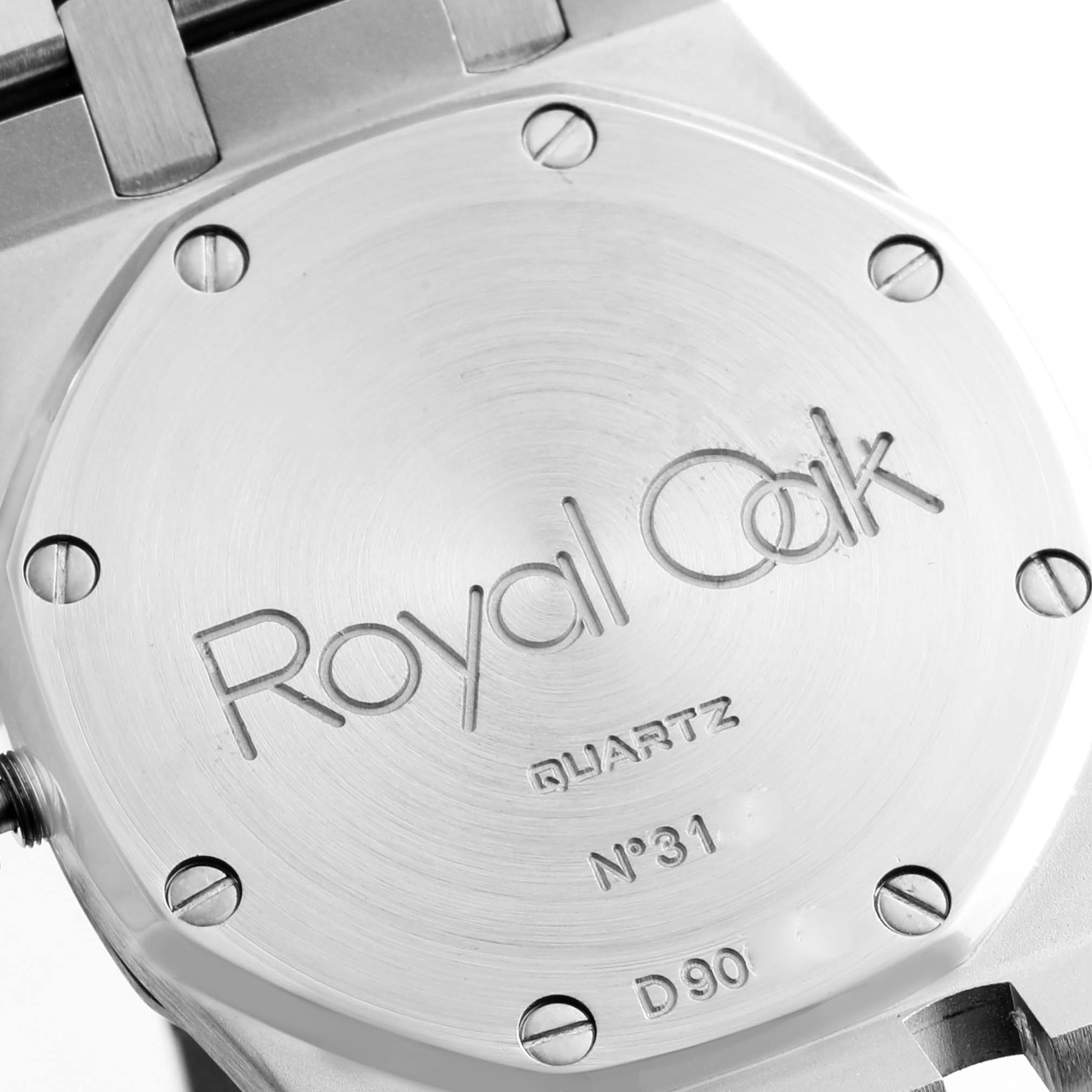 The image shows the case back of an Audemars Piguet Royal Oak 56303ST.OO.0789ST Men
s Stainless Steel Black Dial 56303ST.OO.0789ST Men
s Stainless Steel Black Dial watch, displaying its engraving and screws.