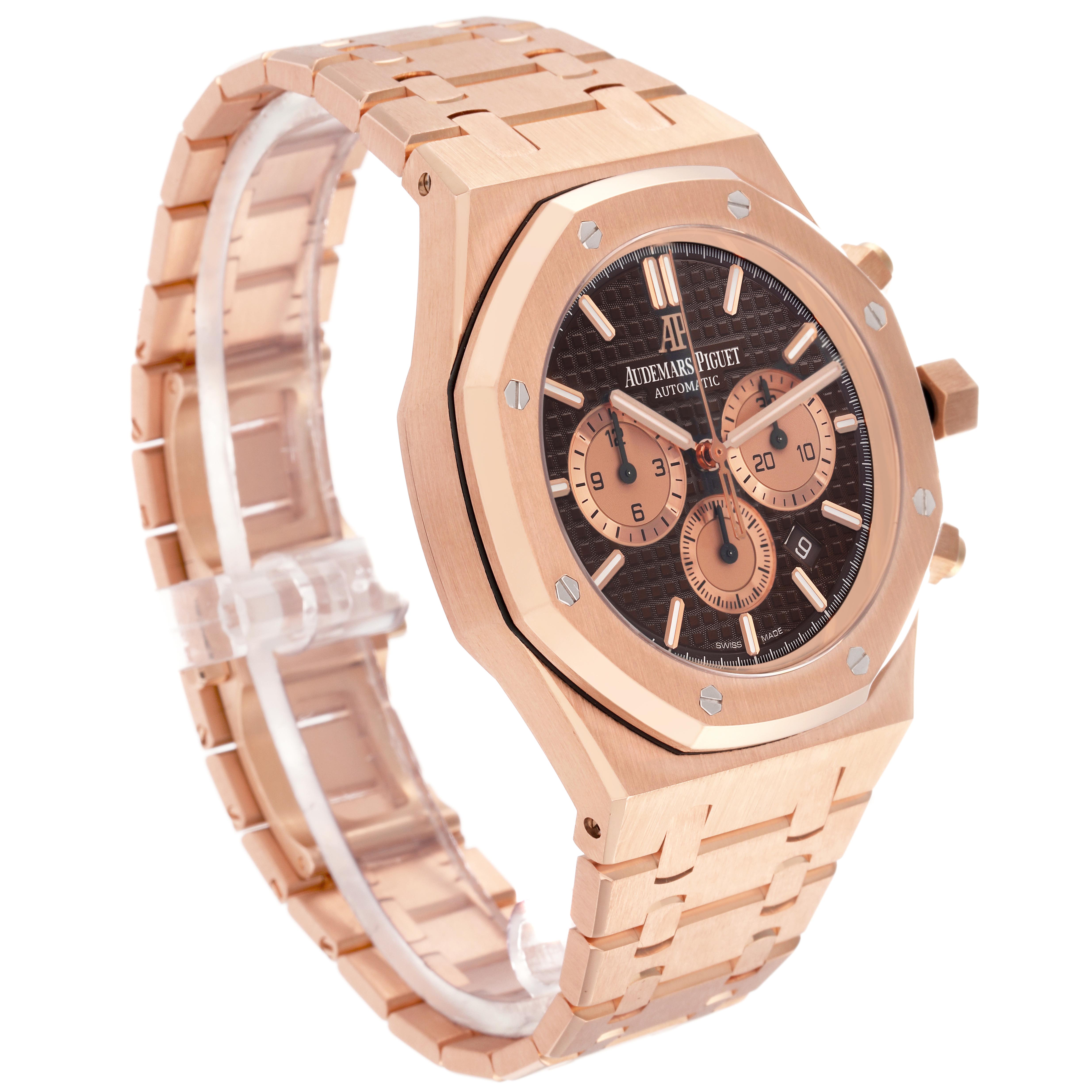 The Audemars Piguet Royal Oak 26331OR.OO.1220OR.02 Men's Rose Gold Brown Dial 26331OR.OO.1220OR.02 Men's Rose Gold Brown Dial watch is shown at an angle highlighting the case, bracelet, and dial with chronograph sub-dials.
