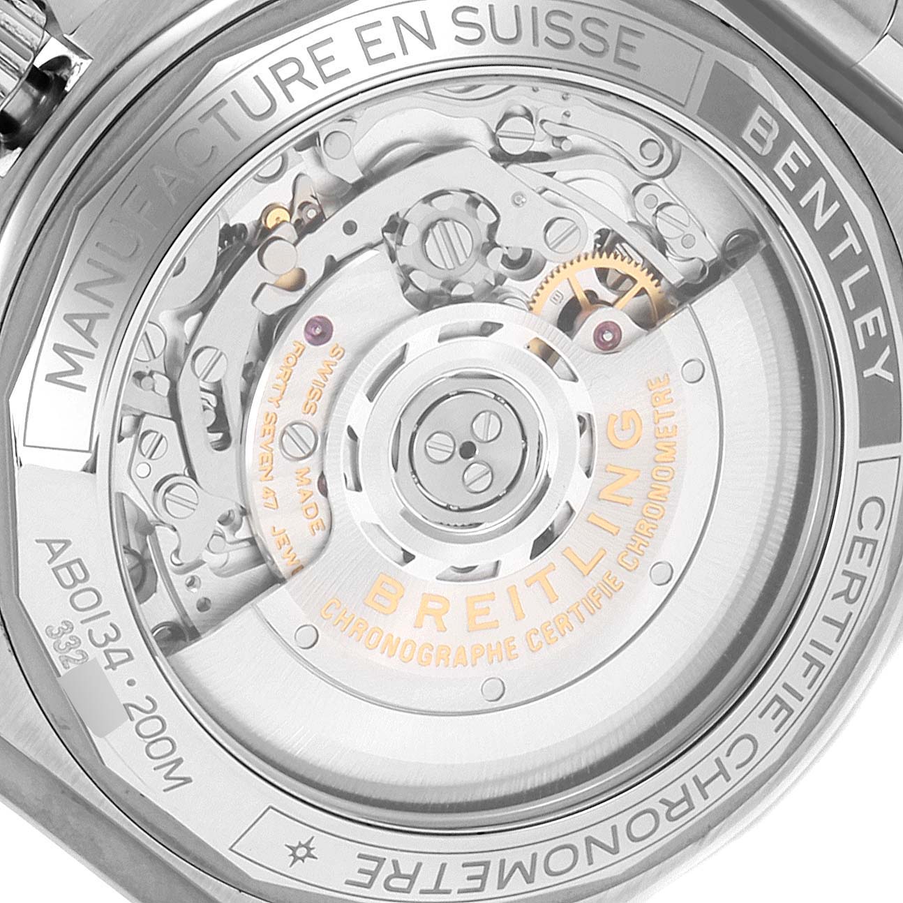 The image shows a close-up view of the transparent case back of a Breitling Chronomat AB01343A1L1A1 Men
s Stainless Steel Green Dial AB01343A1L1A1 Men
s Stainless Steel Green Dial watch, revealing its internal mechanical movement.