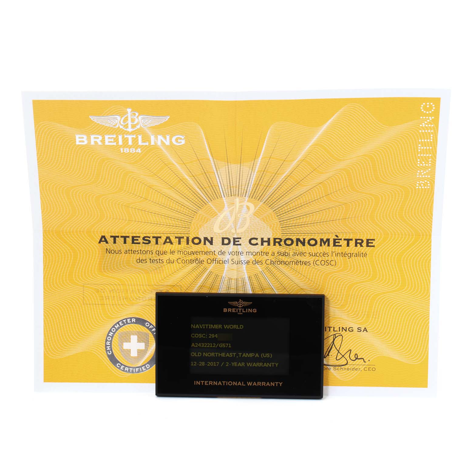 Displayed are the certificate of chronometer attestation and an international warranty card for the Breitling Navitimer A24322 Men
s Stainless Steel Silver Dial A24322 Men
s Stainless Steel Silver Dial model.