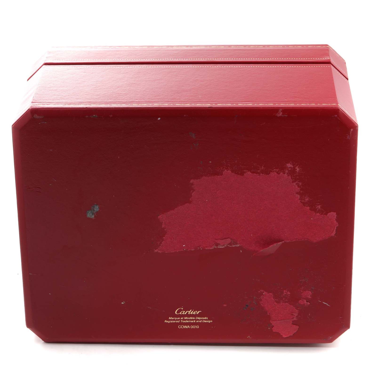 The image shows the red outer box of a Cartier Roadster W62019X6 Men
s Stainless Steel Silver Dial W62019X6 Men
s Stainless Steel Silver Dial watch, with visible wear and a logo at the bottom.