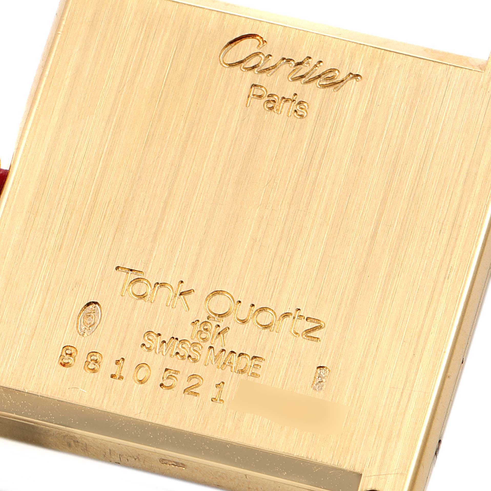 This image shows the back case of the Cartier Tank Classic Women's Yellow Gold White Dial Women's Yellow Gold White Dial watch, showcasing the brand, model, and specifications.