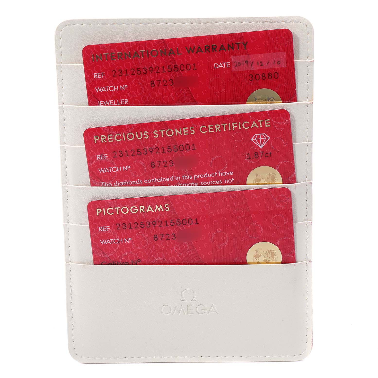 This image shows the international warranty card, precious stones certificate, and pictograms card for an Omega 231.25.39.21.55.001 Women's Steel and Gold (two tone) Mother of Pearl Dial 231.25.39.21.55.001 Women's Steel and Gold (two tone) Mother of Pearl Dial Aqua Terra Steel Rose Gold Diamond Ladies Watch 231.25.39.21.55.001.