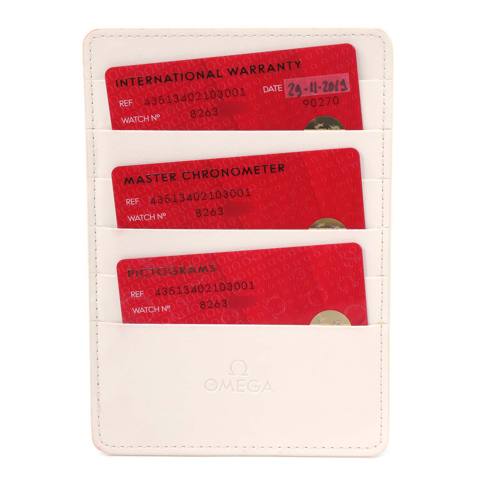 The image shows warranty and certification cards in a holder for the Omega De Ville 435.13.40.21.03.001 Men's Stainless Steel Blue Dial 435.13.40.21.03.001 Men's Stainless Steel Blue Dial watch.