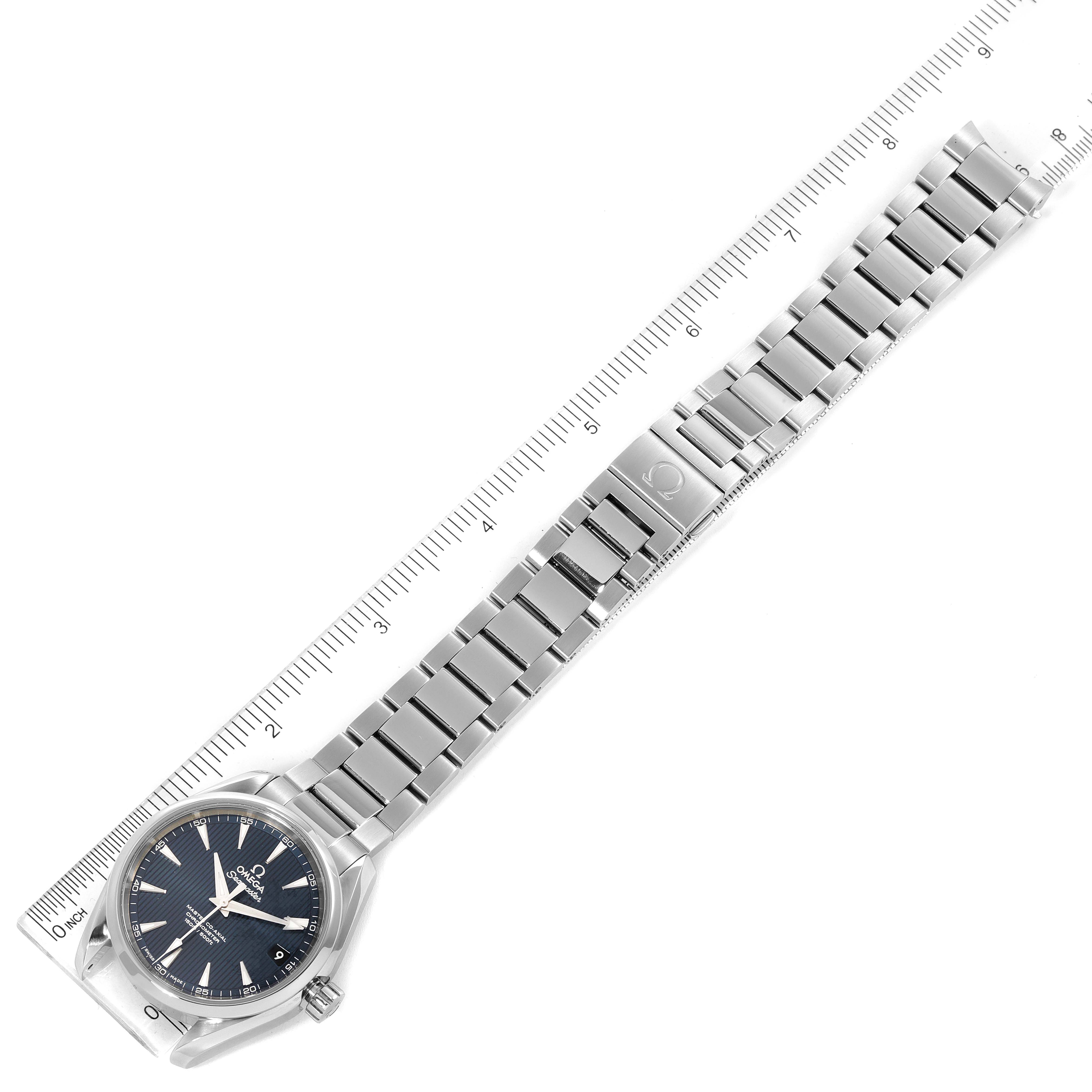 The image shows an Omega Aqua Terra 231.10.39.21.03.002 Men's Stainless Steel Blue Dial 231.10.39.21.03.002 Men's Stainless Steel Blue Dial watch with its full metal bracelet laid flat and measured against a ruler from a top-down angle.