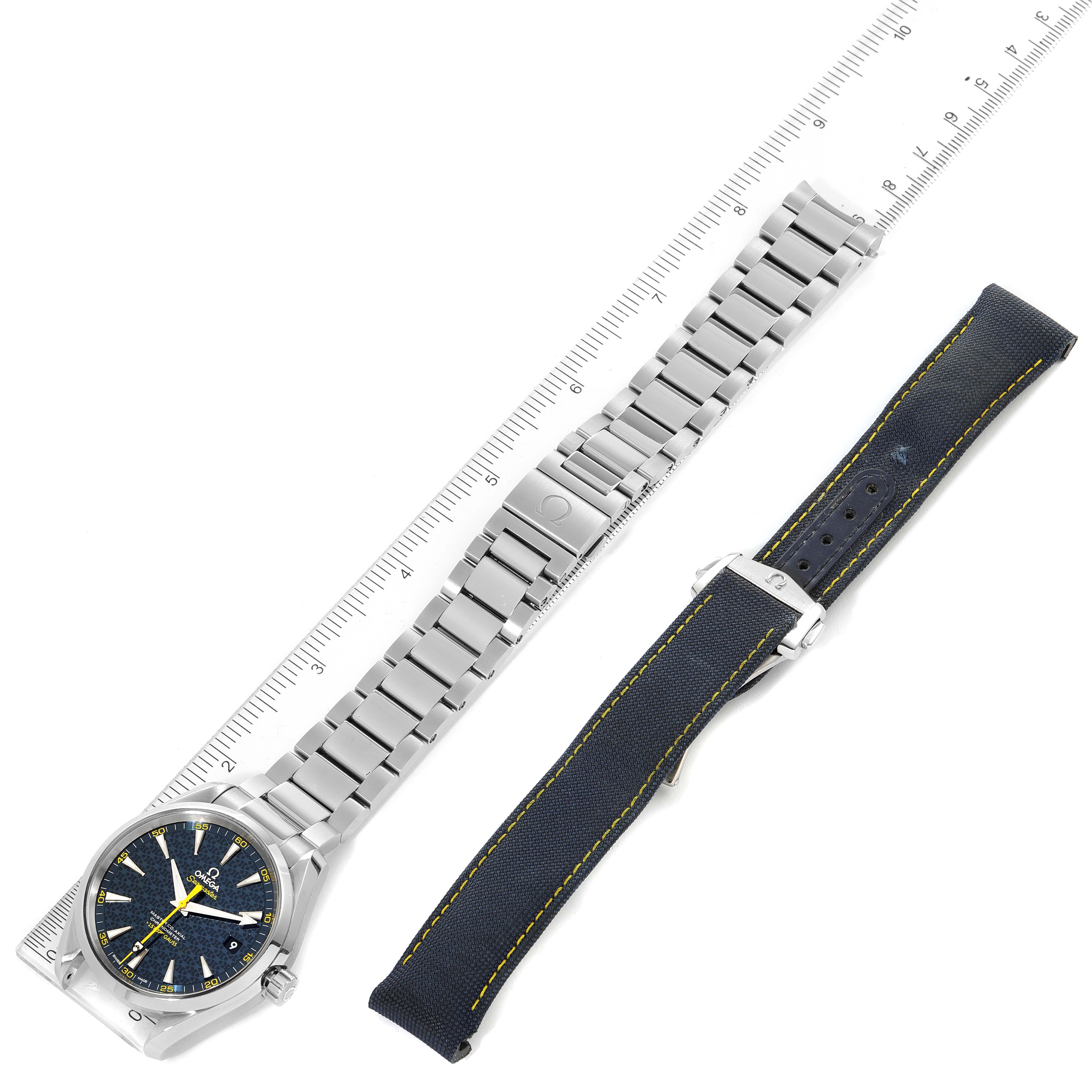 The image shows the Omega Aqua Terra 231.10.42.21.03.004 Men
s Stainless Steel Blue Dial 231.10.42.21.03.004 Men
s Stainless Steel Blue Dial watch, its metal bracelet, and an additional fabric strap, laid flat with a ruler.