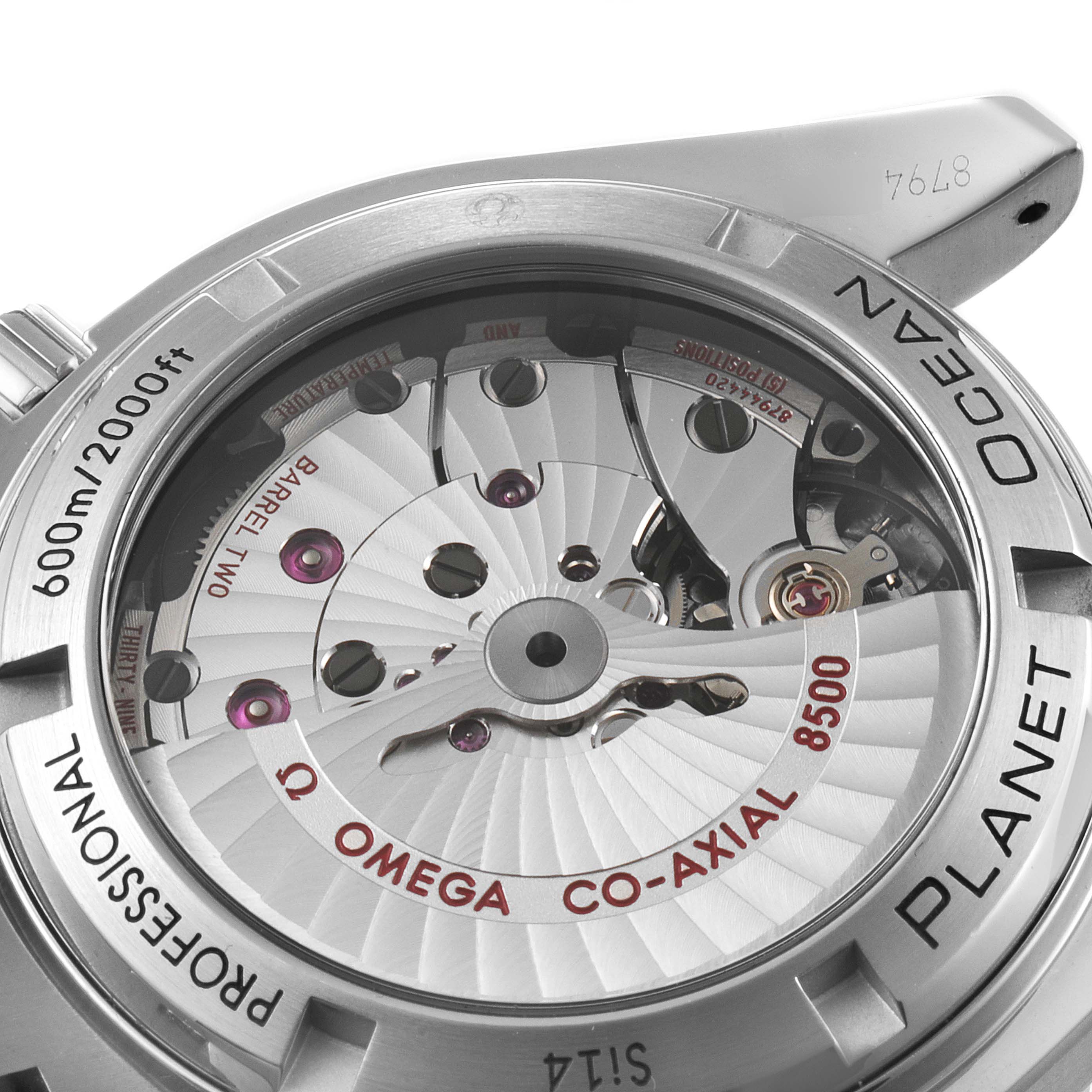 This image shows the back of the Omega Planet Ocean 232.30.42.21.01.002 Men
s Stainless Steel Black Dial 232.30.42.21.01.002 Men
s Stainless Steel Black Dial watch, focusing on its exposed Co-Axial 8500 movement mechanism and engravings.