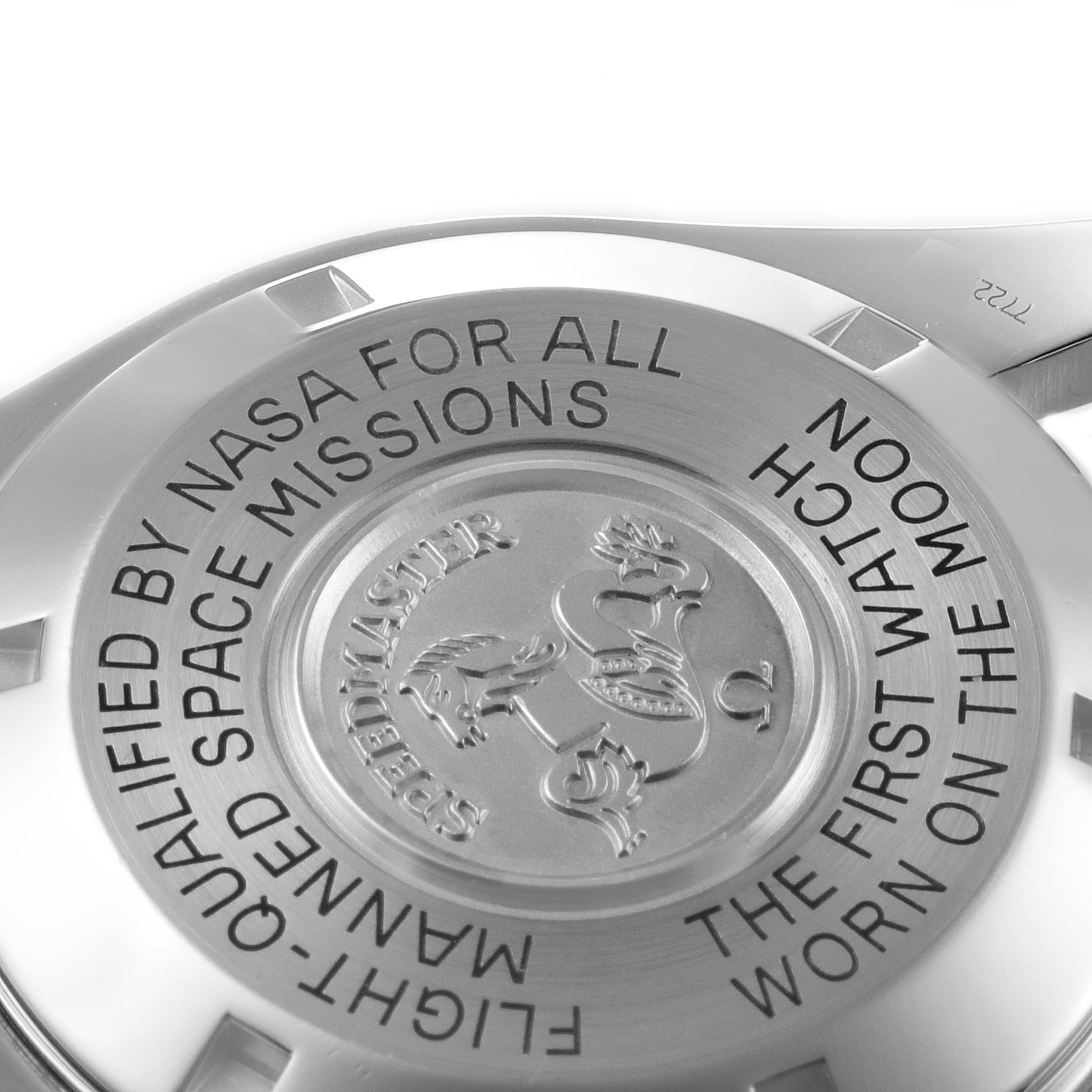 This is a close-up of the case back of the Omega Speedmaster 3570.50.00 Men's Stainless Steel Black Dial 3570.50.00 Men's Stainless Steel Black Dial, highlighting the engraved text and insignia.