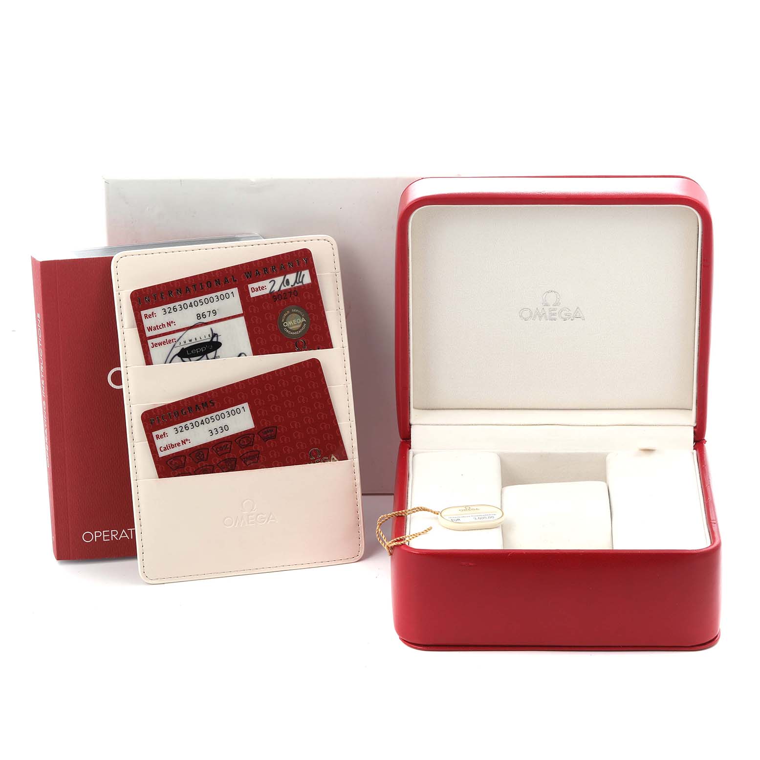 The image shows an Omega Speedmaster 326.30.40.50.03.001 Men's Stainless Steel Blue Dial 326.30.40.50.03.001 Men's Stainless Steel Blue Dial box set with operation manuals and warranty cards at a slightly elevated angle.