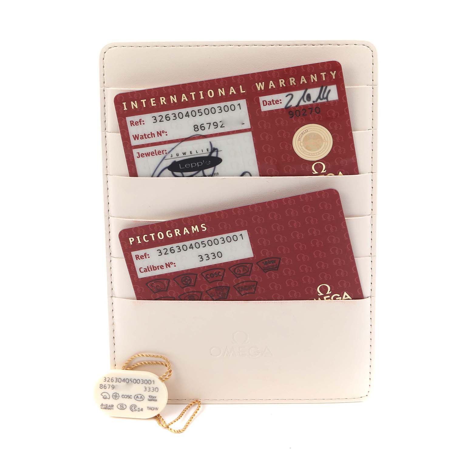 The image shows warranty cards and a tag for an Omega Speedmaster 326.30.40.50.03.001 Men's Stainless Steel Blue Dial 326.30.40.50.03.001 Men's Stainless Steel Blue Dial, placed in a cardholder.