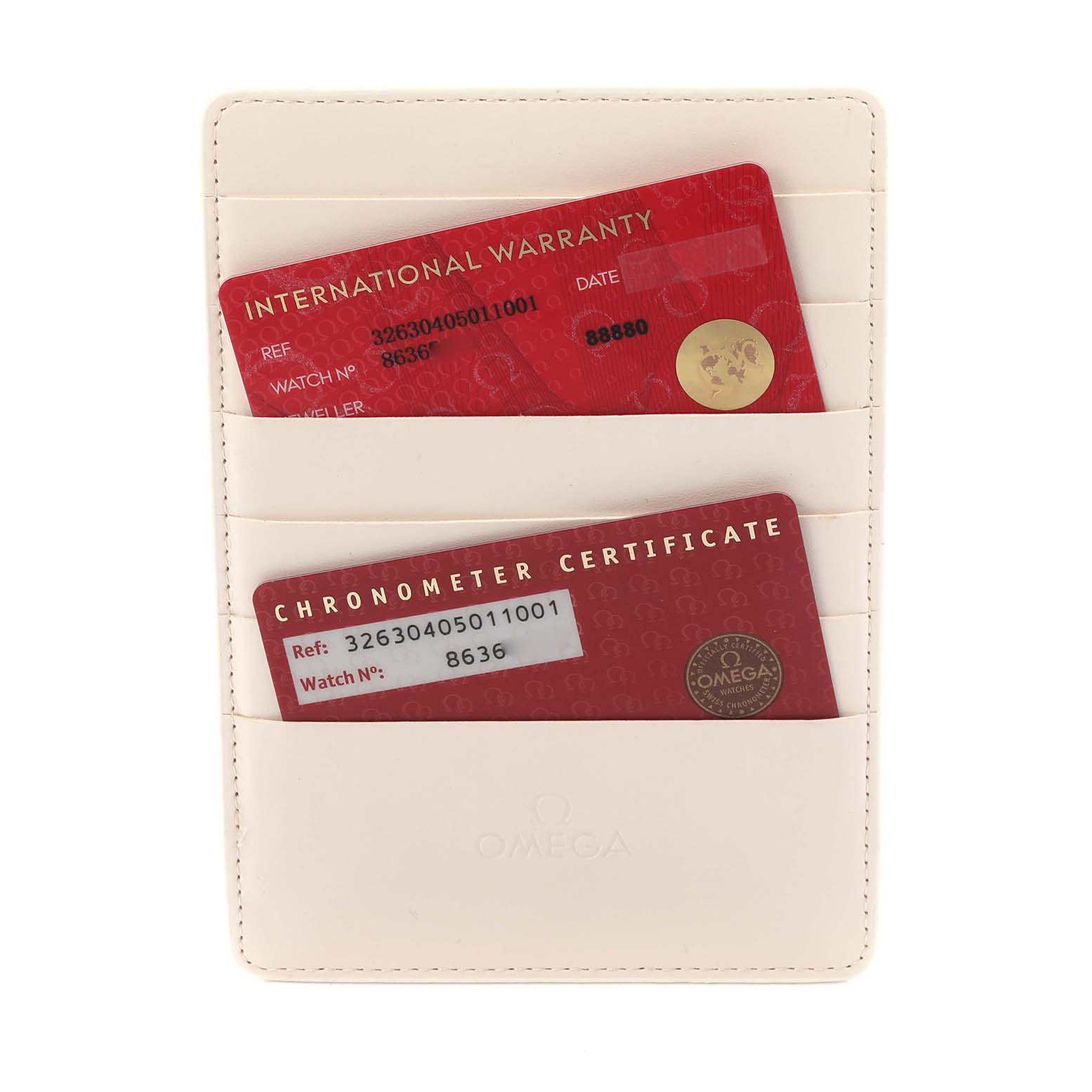 The image shows Omega Speedmaster 326.30.40.50.11.001 Men's Stainless Steel Red Dial 326.30.40.50.11.001 Men's Stainless Steel Red Dial watch accessories, including warranty and chronometer certificate cards in a holder.