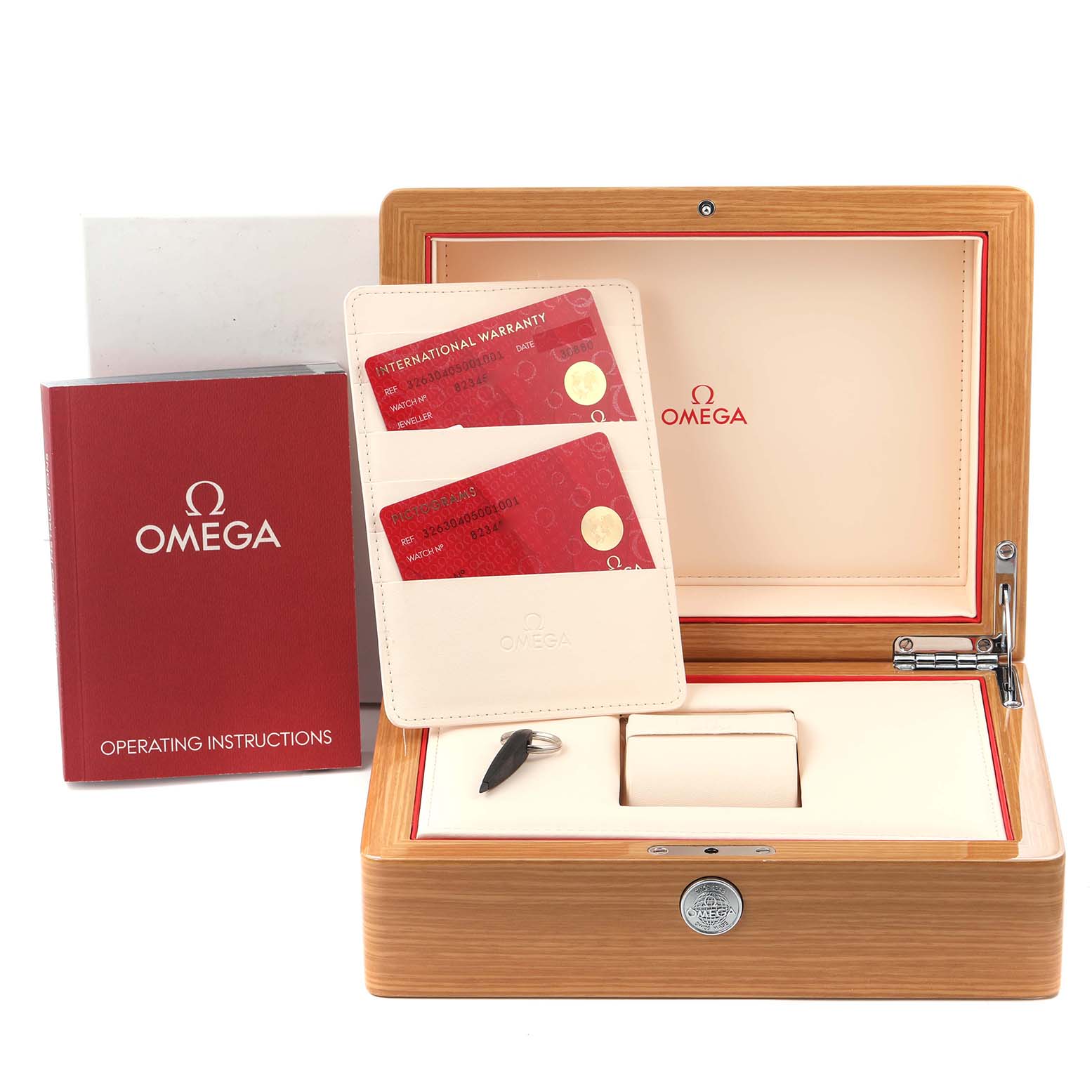 The image shows an Omega Speedmaster 326.30.40.50.01.001 Men's Stainless Steel Black Dial 326.30.40.50.01.001 Men's Stainless Steel Black Dial presentation box, warranty cards, an instruction manual, and a small tool.