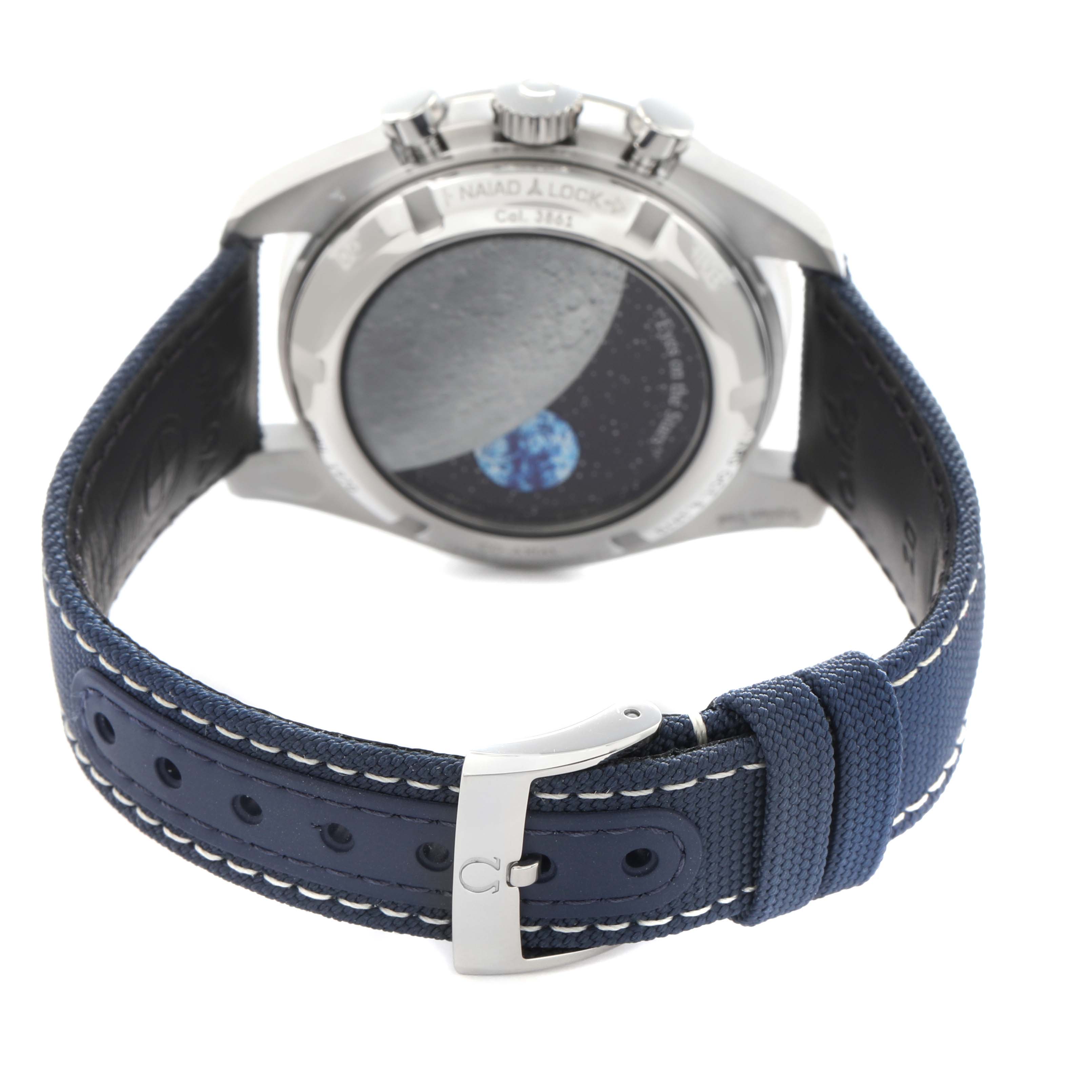 The Omega Speedmaster 310.32.42.50.02.001 Men's Stainless Steel Silver Dial 310.32.42.50.02.001 Men's Stainless Steel Silver Dial is shown from the back, highlighting the case back and blue strap with buckle.