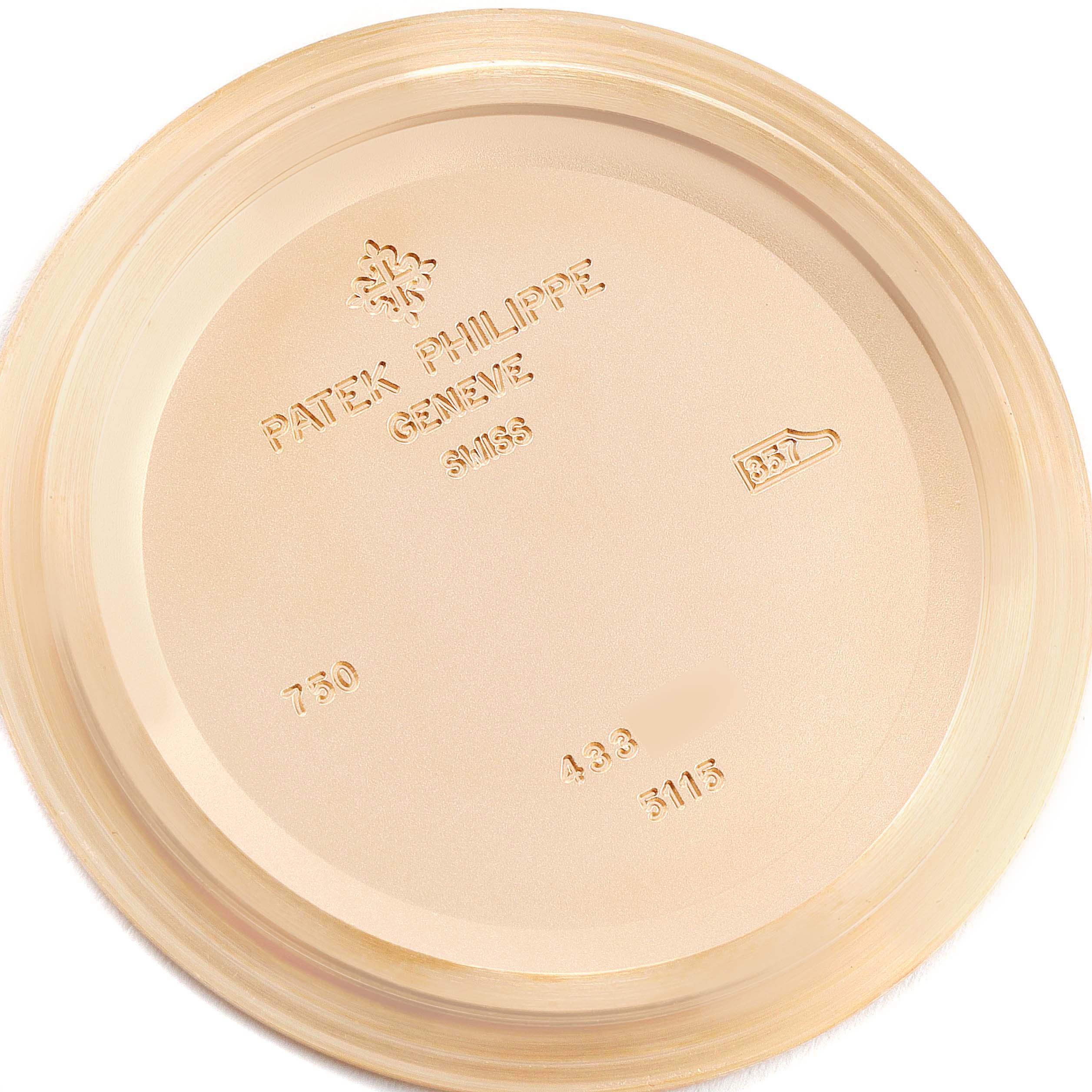 The image shows the inside of a Patek Philippe Calatrava 5115R-001 Men's Rose Gold White Dial 5115R-001 Men's Rose Gold White Dial watch case back, featuring engraved branding details.
