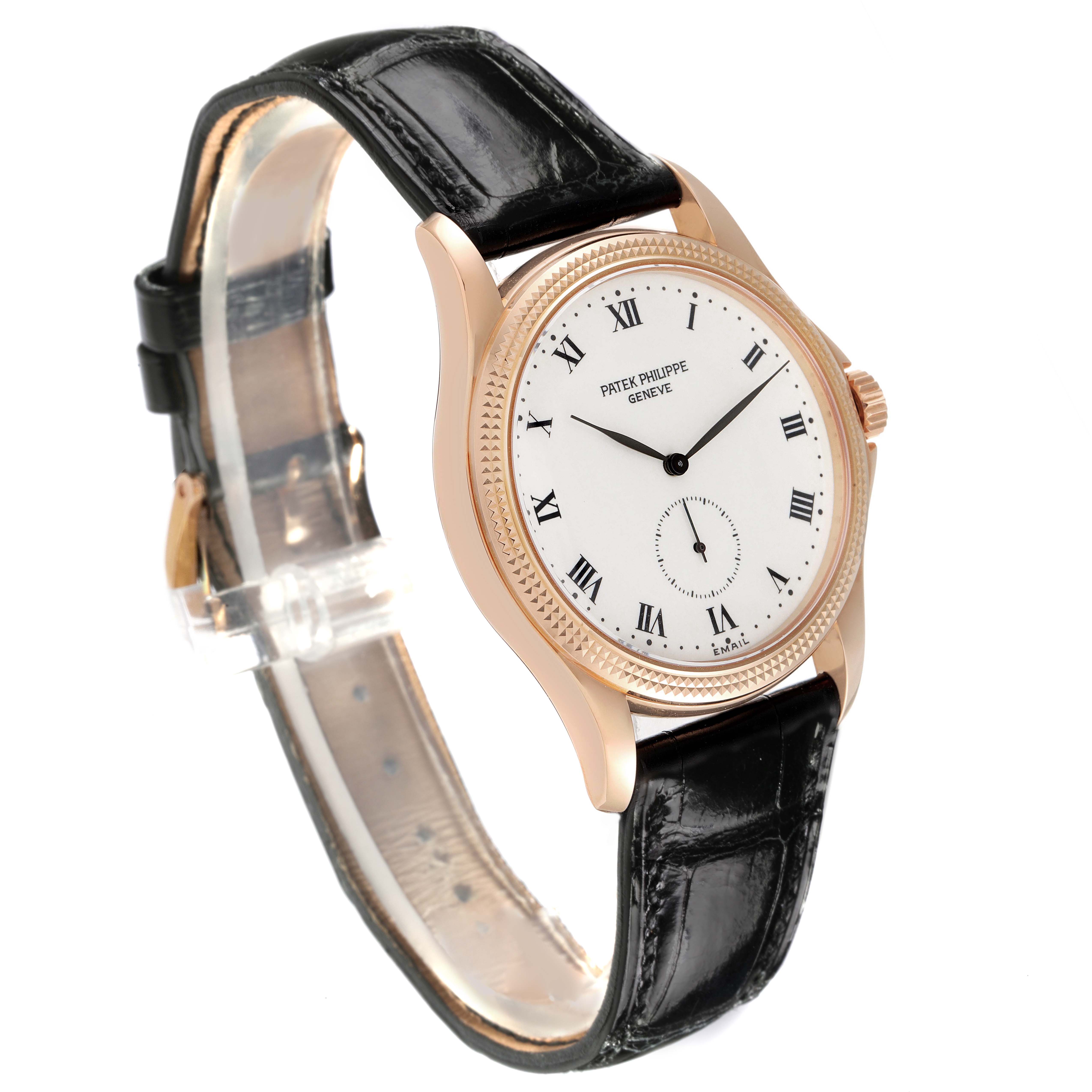 The Patek Philippe Calatrava 5115R-001 Men's Rose Gold White Dial 5115R-001 Men's Rose Gold White Dial watch is shown at a 3/4 angle, featuring the dial, bezel, crown, and a black leather strap.