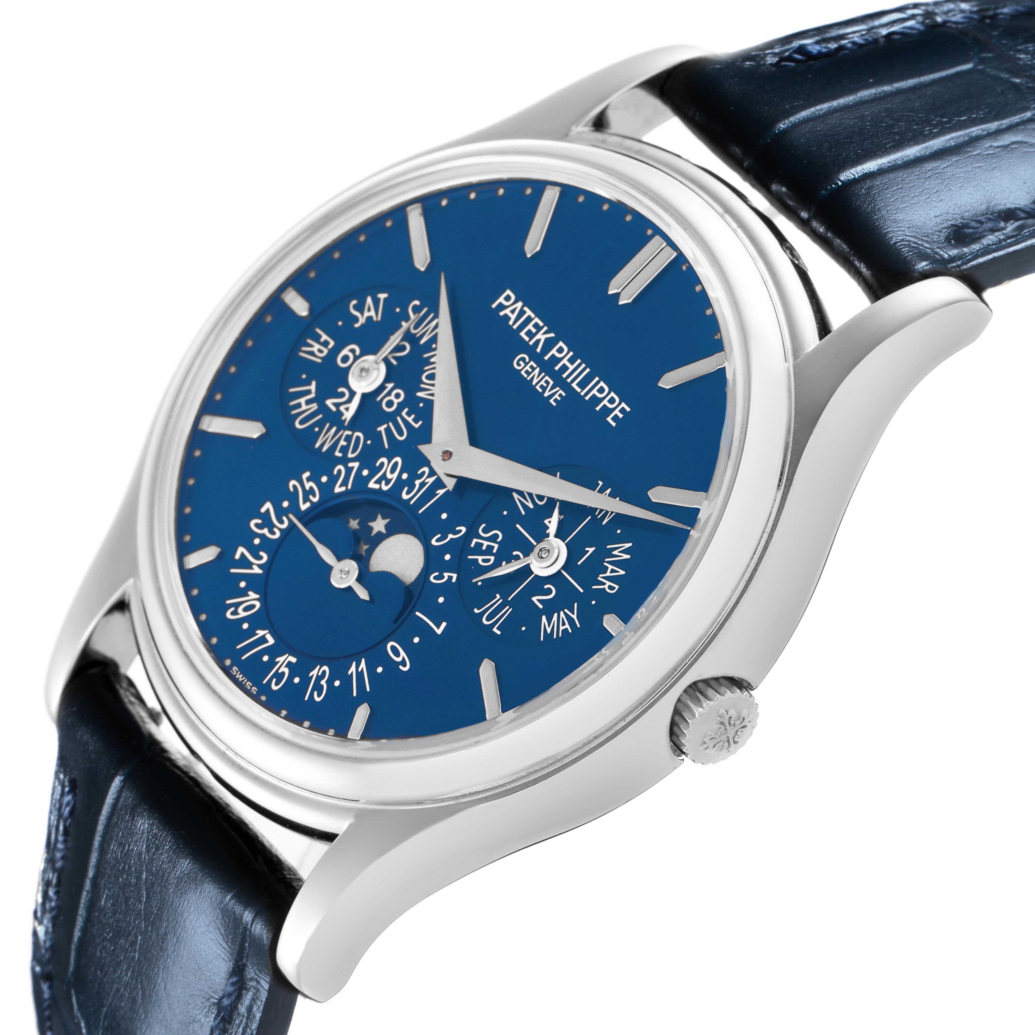 The Patek Philippe Complications 5140P-001 Men's Platinum Blue Dial 5140P-001 Men's Platinum Blue Dial watch is shown at an oblique angle, displaying the dial, case, and part of the strap.