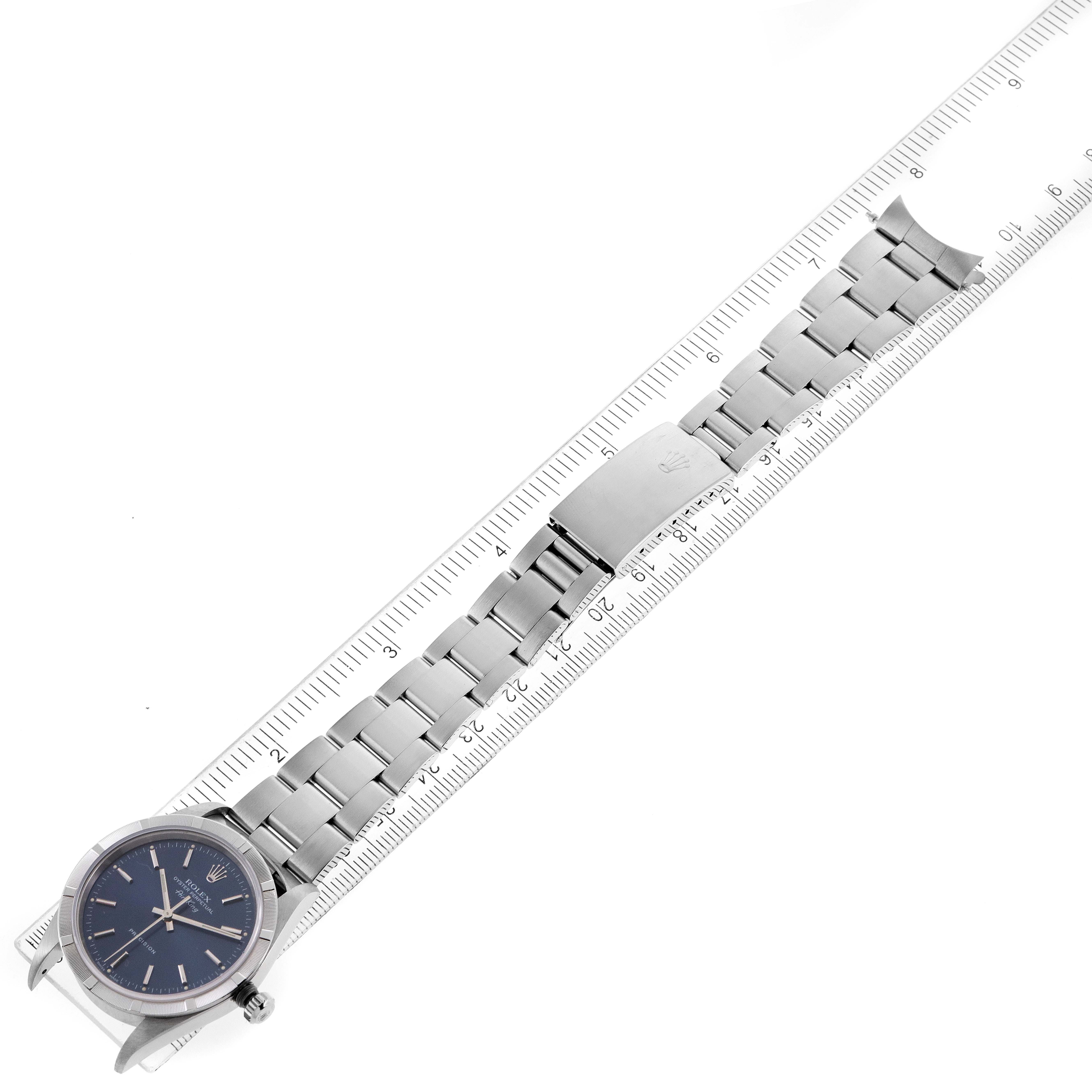 The image shows a top-down view of a Rolex Air-King 14010 Men's Stainless Steel Blue Dial 14010 Men's Stainless Steel Blue Dial watch, including its face and metal bracelet, measured with a ruler.