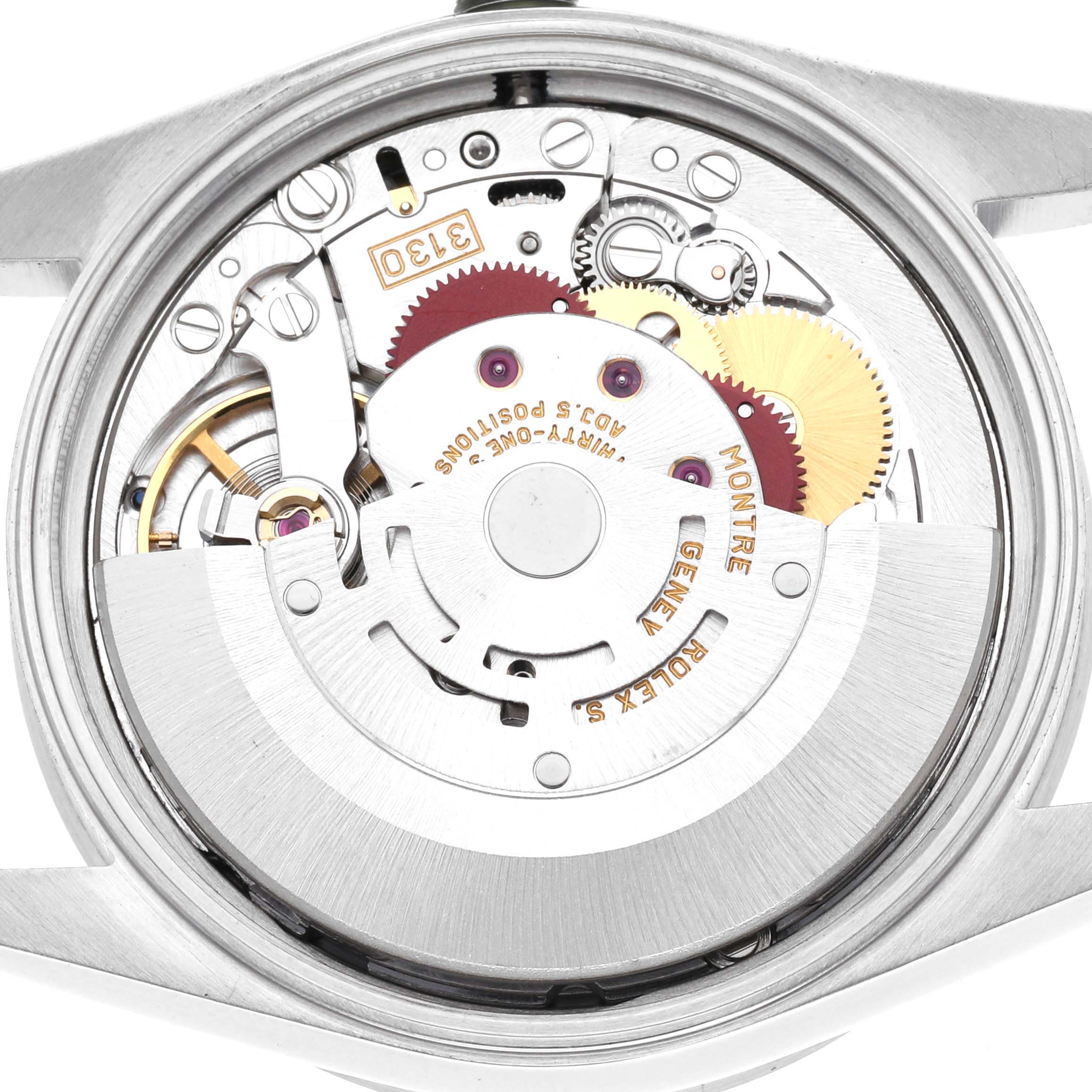 The image shows the movement of a Rolex Air-King 14010 Men's Stainless Steel Blue Dial 14010 Men's Stainless Steel Blue Dial watch from the back, highlighting gears and parts of the mechanism.