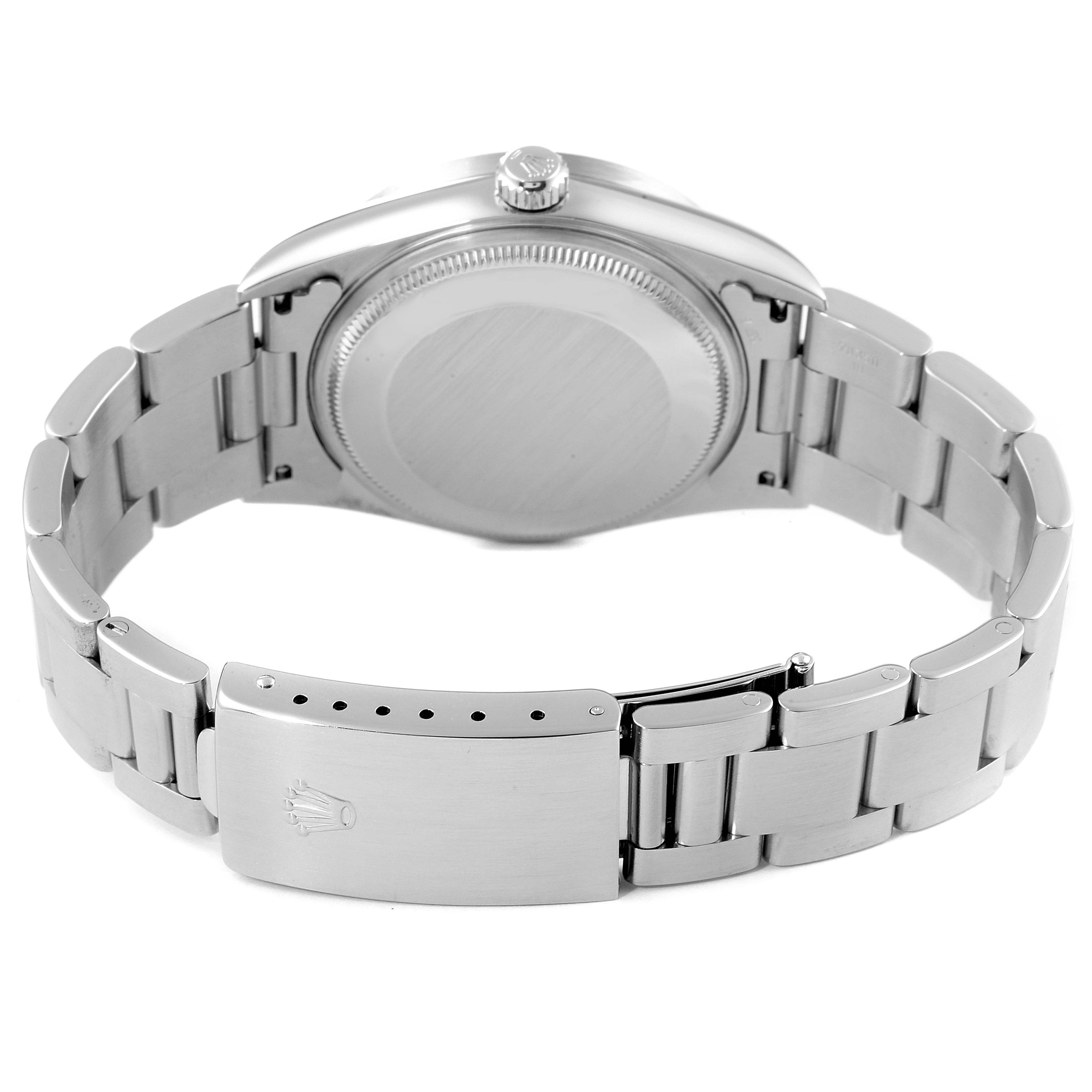 The image shows the back view of a Rolex Air-King 14010 Men's Stainless Steel Silver Dial 14010 Men's Stainless Steel Silver Dial watch, highlighting the case back, crown, and metal bracelet with its clasp.