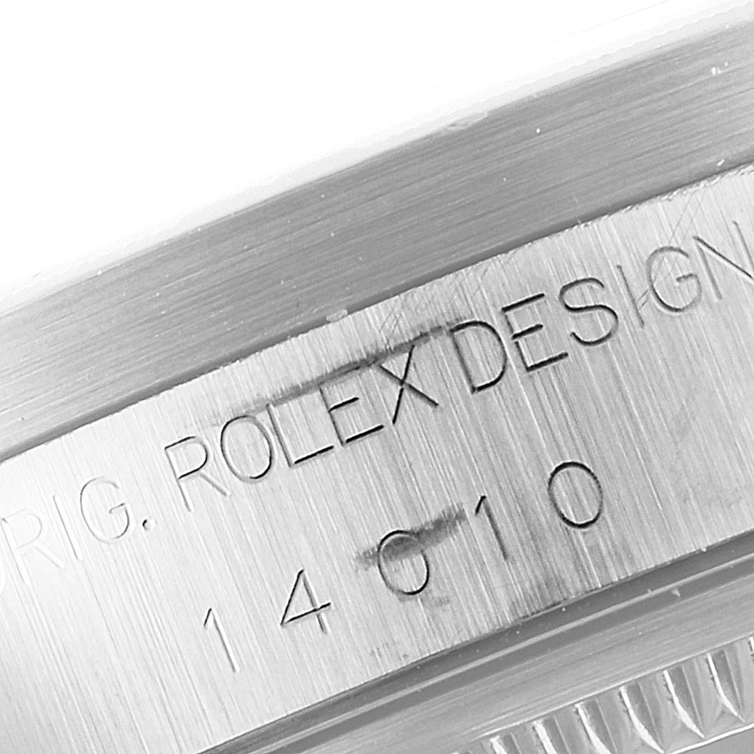 This close-up image shows the engraving on the case side of a Rolex Air-King 14010 Men's Stainless Steel Silver Dial 14010 Men's Stainless Steel Silver Dial model watch, highlighting its serial number.