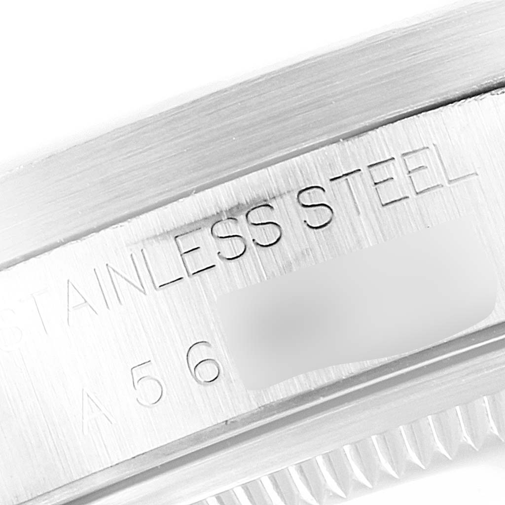 The image shows a close-up of the engraving and edge of the case back of a Rolex Air-King 14010 Men's Stainless Steel Silver Dial 14010 Men's Stainless Steel Silver Dial watch, highlighting the stainless steel marking.
