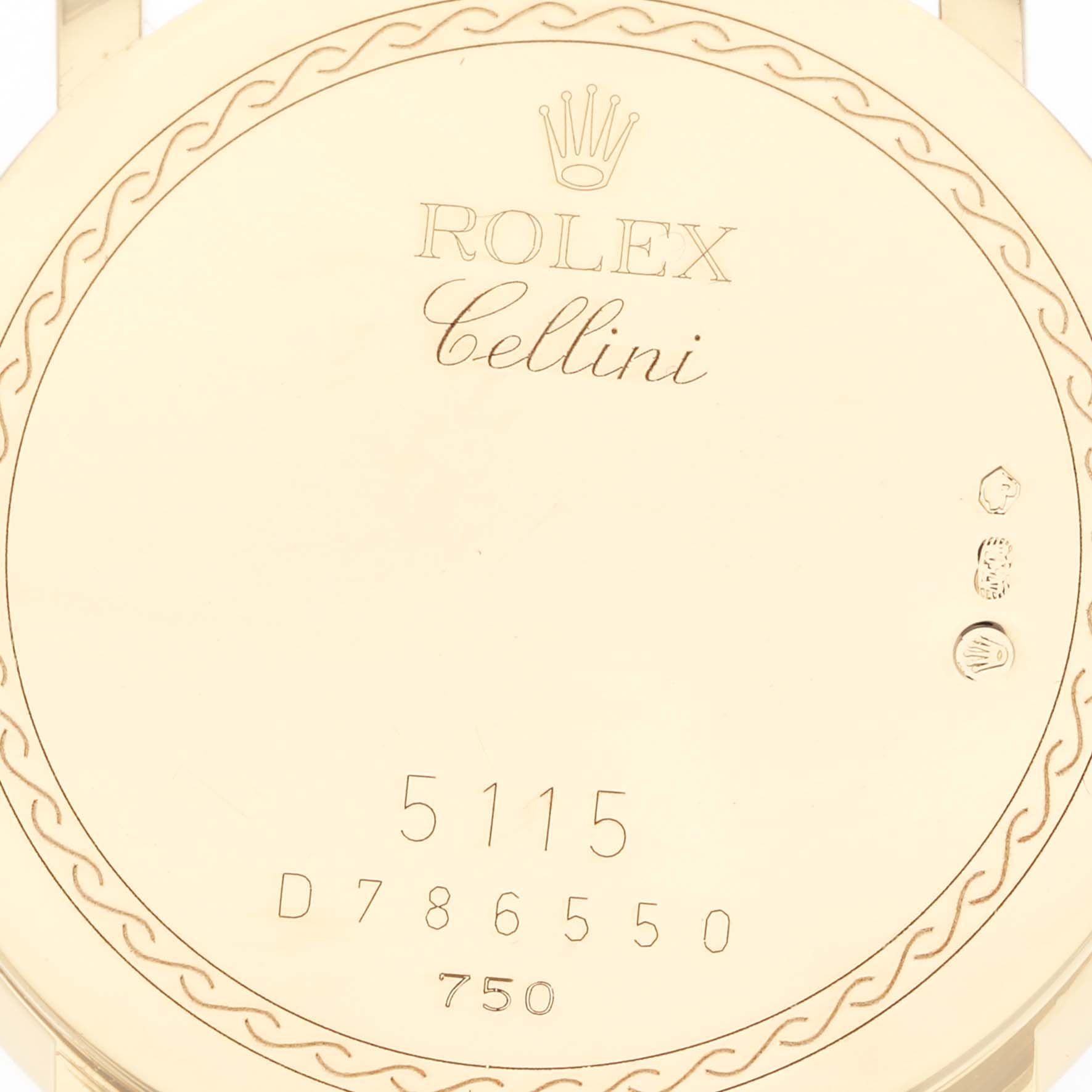 The image shows the back of a Rolex Cellini 5115 Men's Yellow Gold Black Dial 5115 Men's Yellow Gold Black Dial watch, detailing model number 5115 and various engravings.