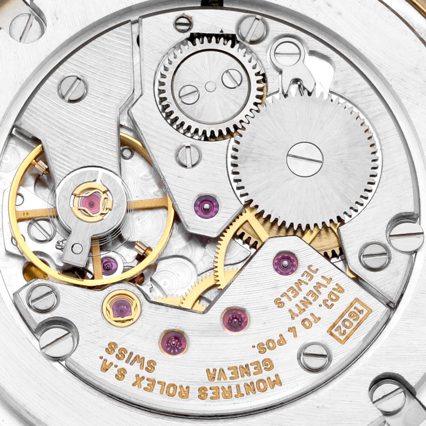 This image shows a close-up of the movement mechanism of a Rolex Cellini 5115 Men's Yellow Gold Black Dial 5115 Men's Yellow Gold Black Dial watch, highlighting gears and components.